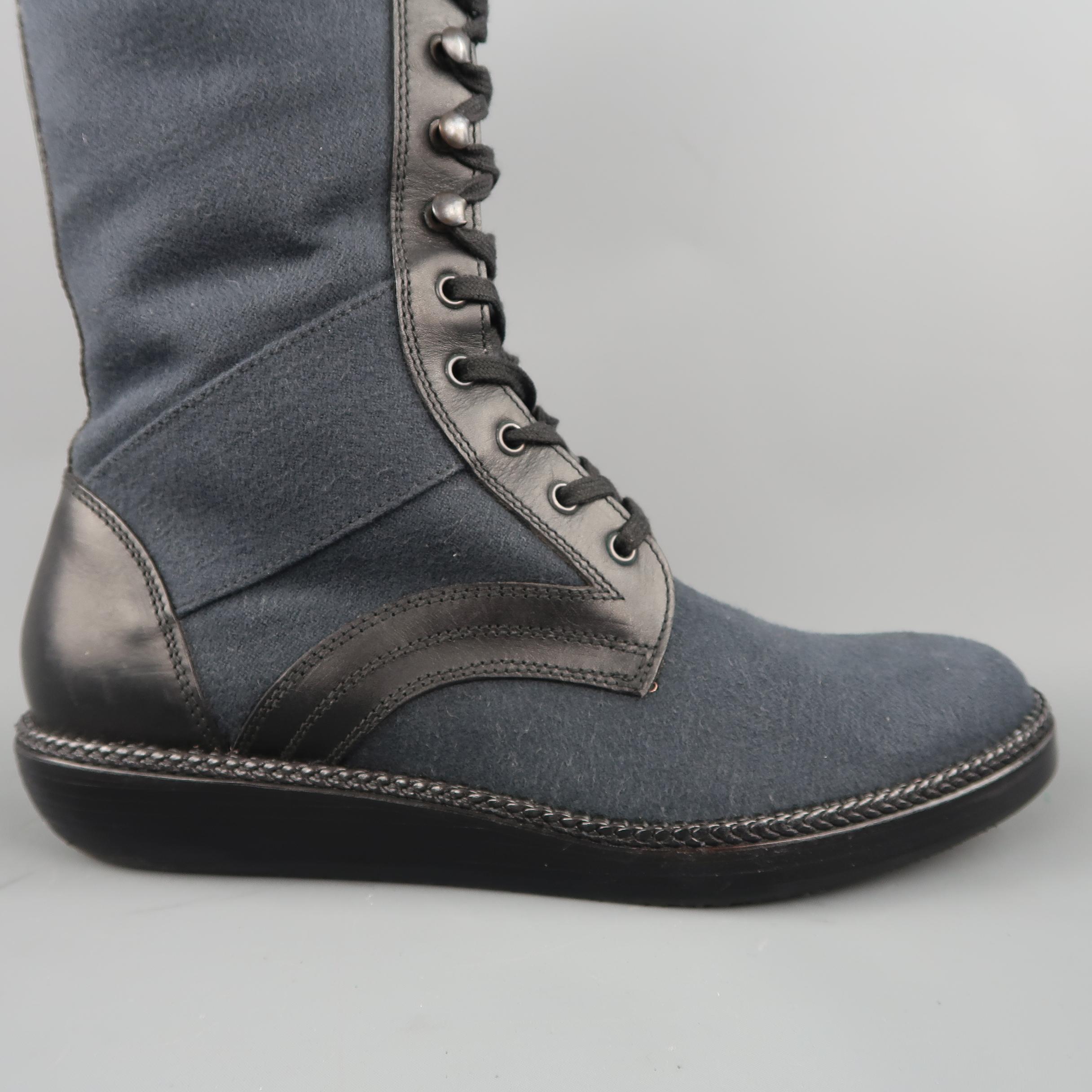 LANVIN tall boots come in muted navy blue brushed cotton canvas with black leather trim and heel, lace up front with ski hooks, and chunky sole. With box. Hand Made in Italy.
 
Excellent Pre-Owned Condition.
Marked: UK 8
 
Measurements:
 
Length: 12