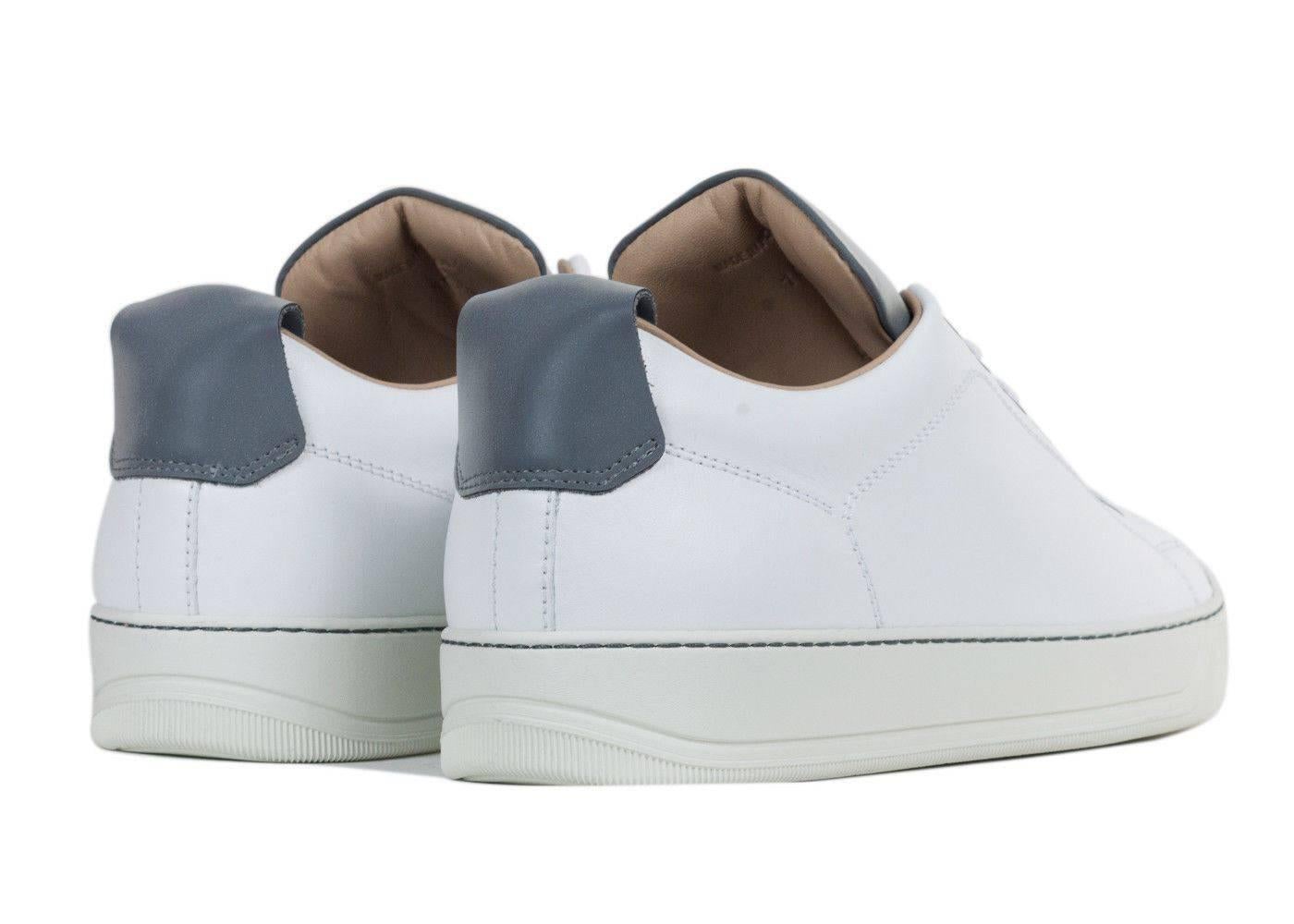 Brand New In Original Box
Retails Online and In-stores for $590
Size UK 6/ US 7  Fits True to Size

The smoothest man in the room definitely owns a pair of Lanvin Cap Toe Sneakers. This modern work of art features a lustrous suede body topped off