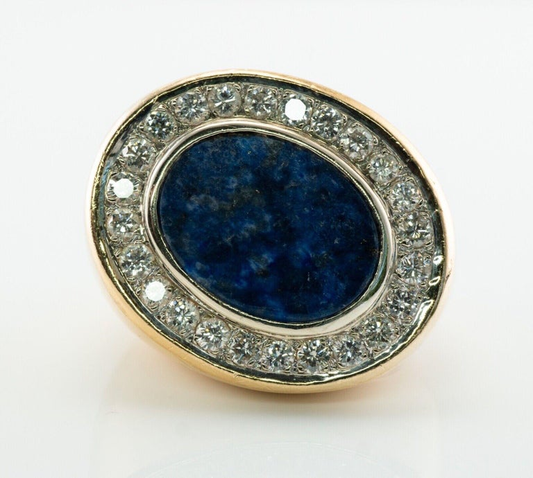 This gorgeous ring for a man is finely crafted in solid 18K Yellow Gold and set with Lapis Lazuli and Diamonds. The center stone measures 16mm x 12mm. 24 white and fiery diamonds are very clean VS2 clarity and G color totaling 2.40 carats. The top