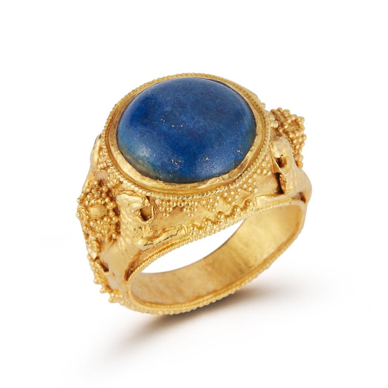Cabochon Blue Lapis Lazuli  set with finely engraved 22 karat gold
Ring Size: 8
Gram Weight: 11.1 grams 