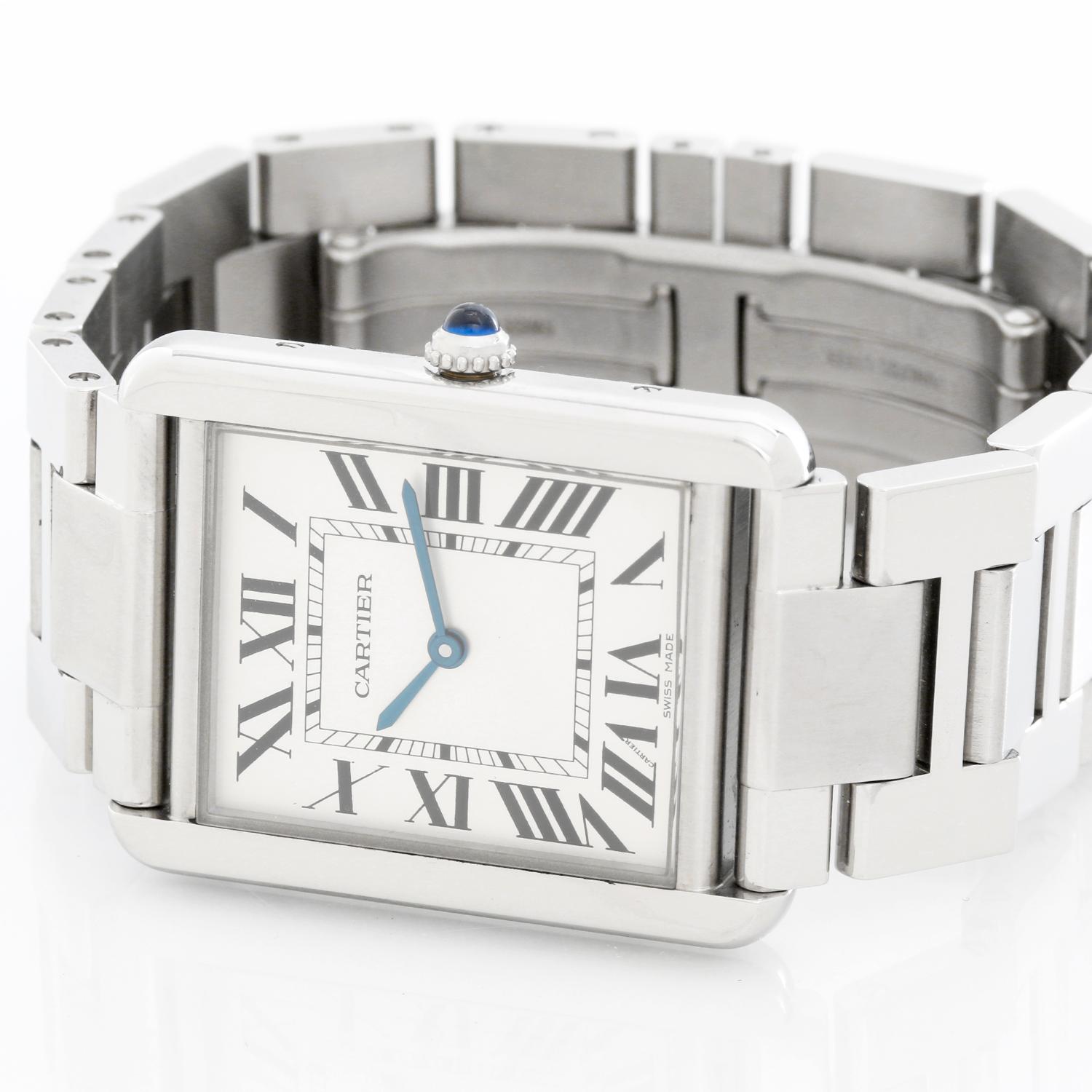 Men's Large Cartier Tank Solo Stainless Steel Watch W5200014 - Quartz. Stainless steel case (27mm x 35mm). Silver dial with black Roman numerals. Stainless steel bracelet (will fit apx. 6 inch wrist). Pre-owned with Cartier box .