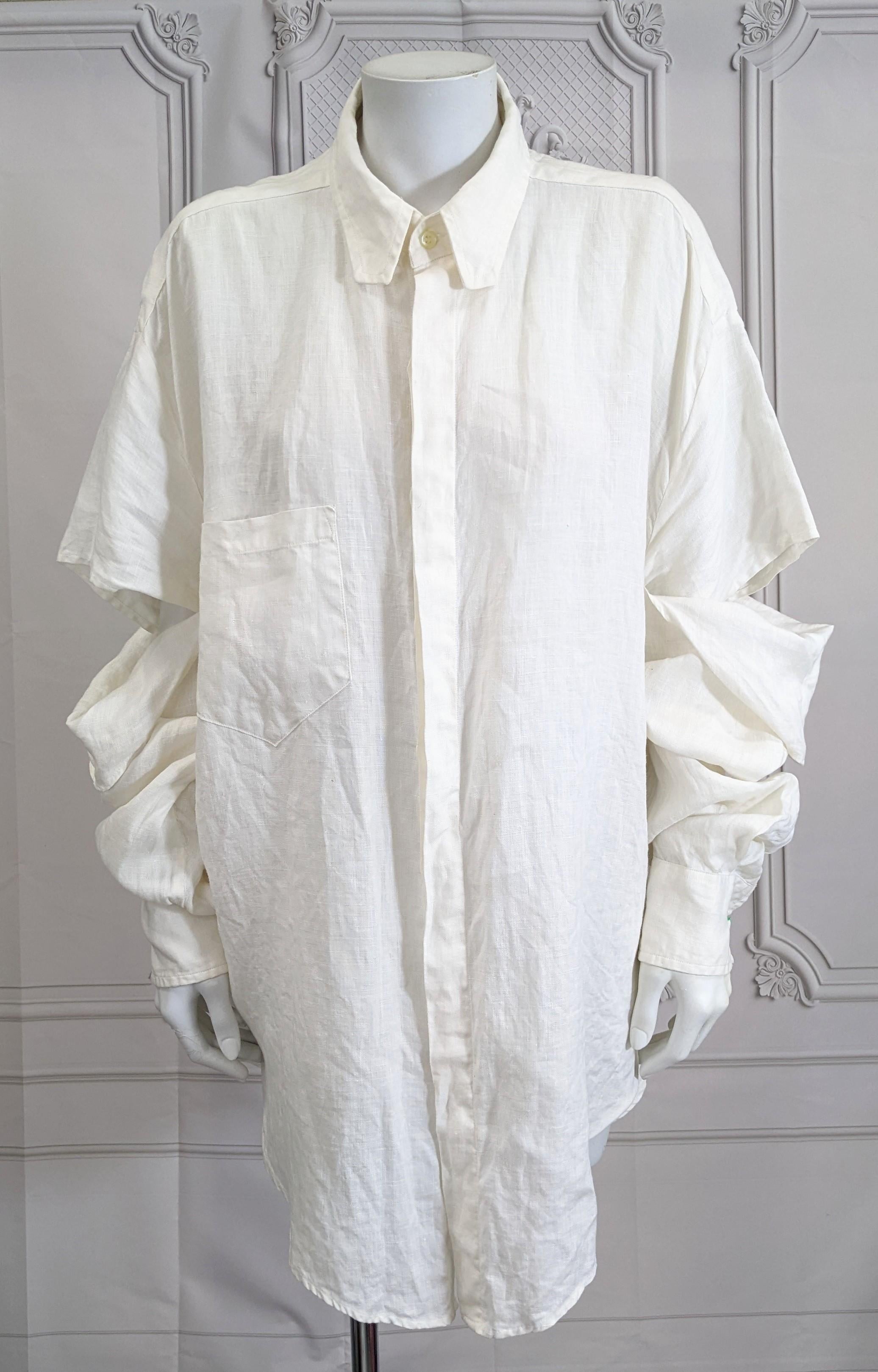 Men's Linen Club Shirt by Susanne Bartsch from the 1980's. Exaggerated New Romantic style proportions with double fall away sleeves and cut point collar. Oversized in ivory linen designed to wrinkle and stain after sustaining a night of frenzied