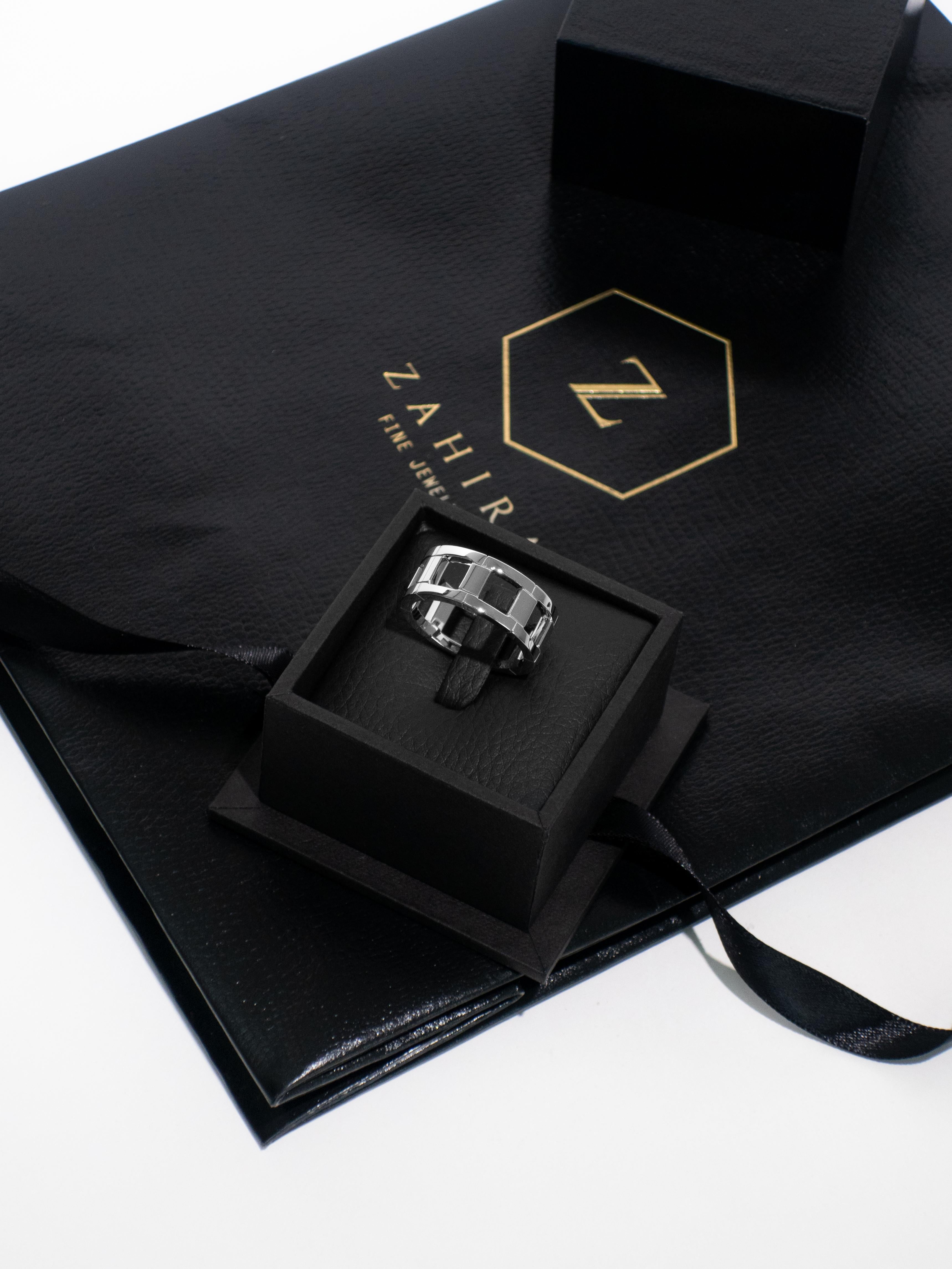 This sleek men's link ring is expertly crafted from 18K white solid gold, featuring a bold, interlocking design that balances strength with refined elegance. Its polished finish offers a modern yet timeless appeal, making it a versatile statement