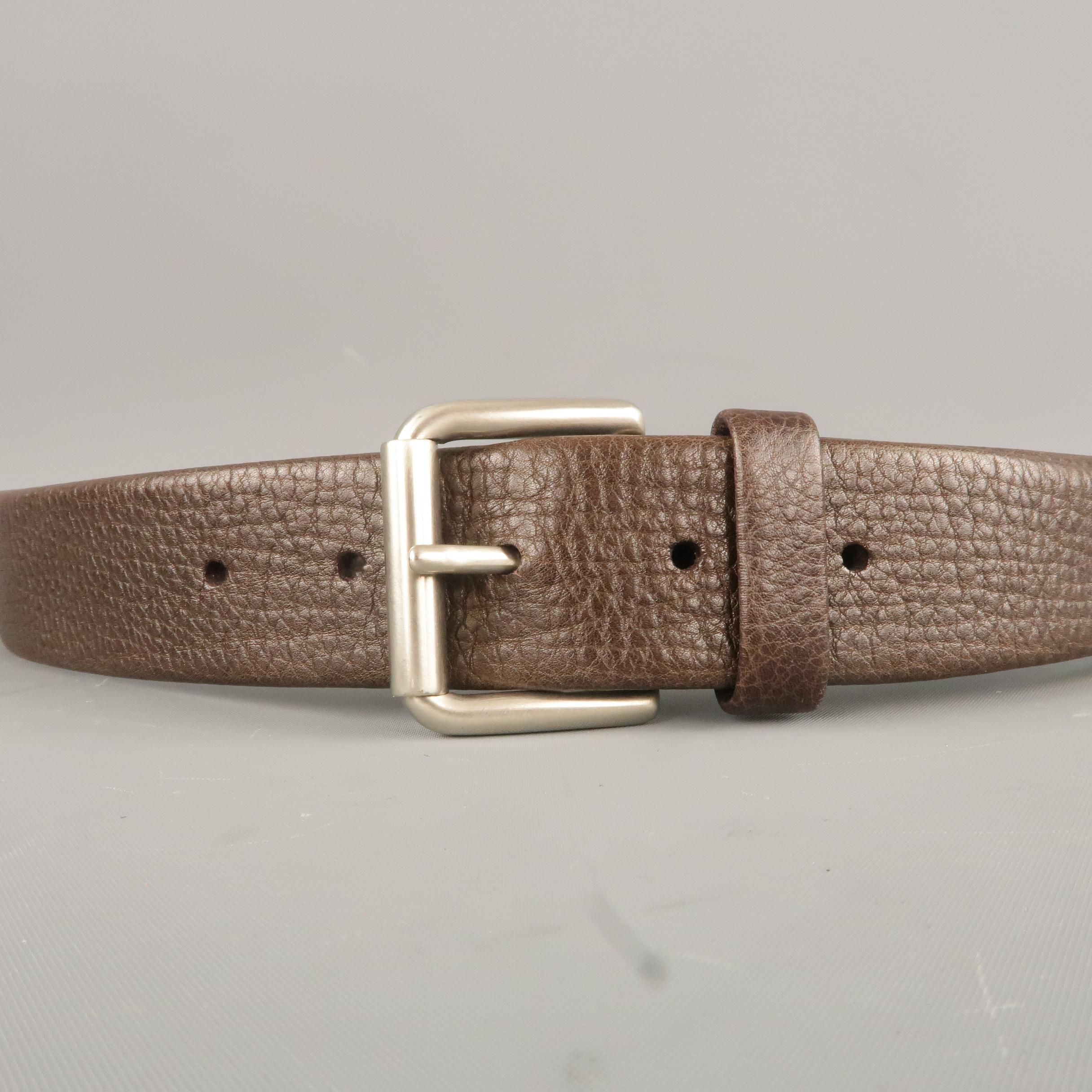 LONGHI belt features a dark taupe brown soft textured leather strap with silver tone square buckle. Made in Italy.
 
Excellent Pre-Owned Condition.
Marked: 36
 
Length: 42.5 in.
Width: 1.25 in.
Fits: 33.5-37.5 in.