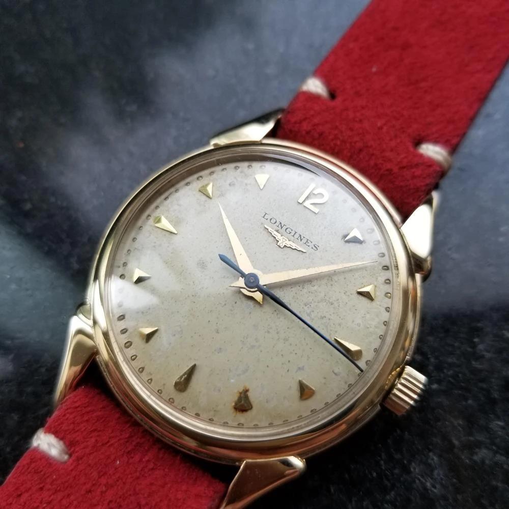 Vintage luxury, men's 14K solid gold Longines manual hand-winding dress watch, c.1960s. Verified authentic by a master watchmaker. Gorgeous, original Longines signed gold dial, applied gold pointed index hour markers, Arabic numeral 12, gold minute