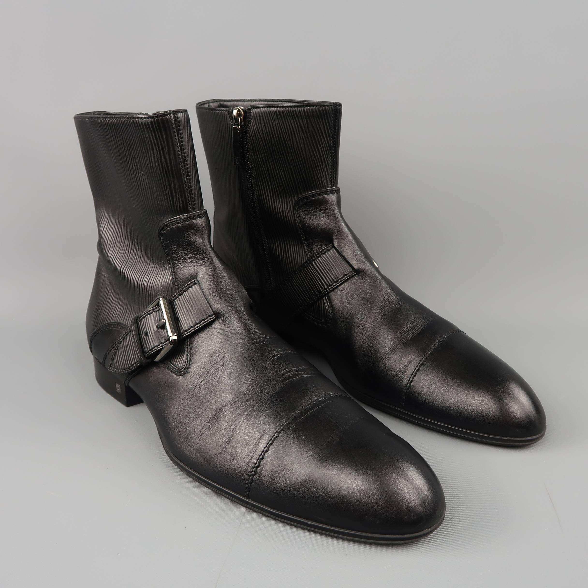 LOUIS VUITTON ankle boots come in smooth black leather with a round pointed cap toe, ankle strap with silver tone buckle, Epi textured leather panel and silver tone monogram emblem heel. Made in Italy.
 
Excellent Pre-Owned Condition.
Marked: UK