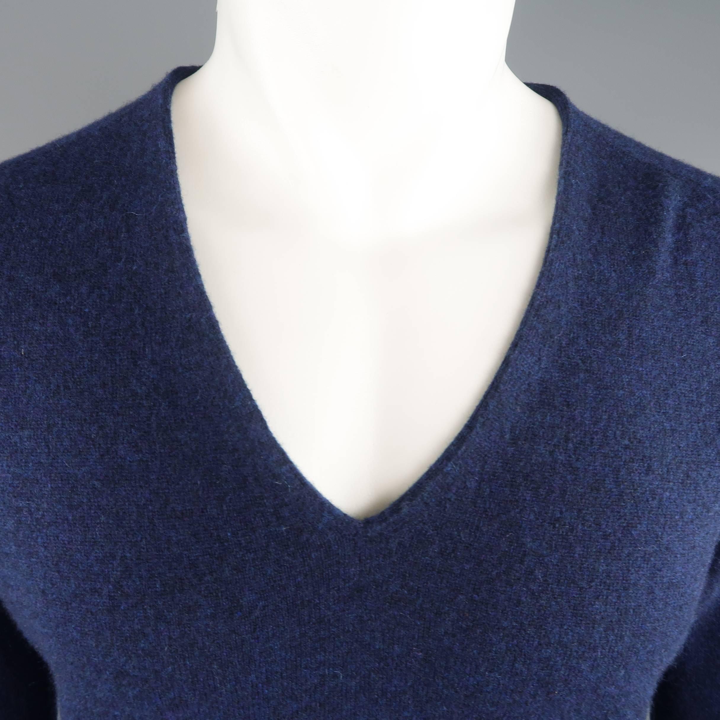 MAISON MARTIN MARGIELA pullover sweater comes in a heathered navy blue cashmere knit with a V neck and signature stitches at back. Made in Italy.
 
Good Pre-Owned Condition.
Marked: M
 
Measurements:
 
Shoulder: 16 in.
Chest: 44 in.
Sleeve: 27