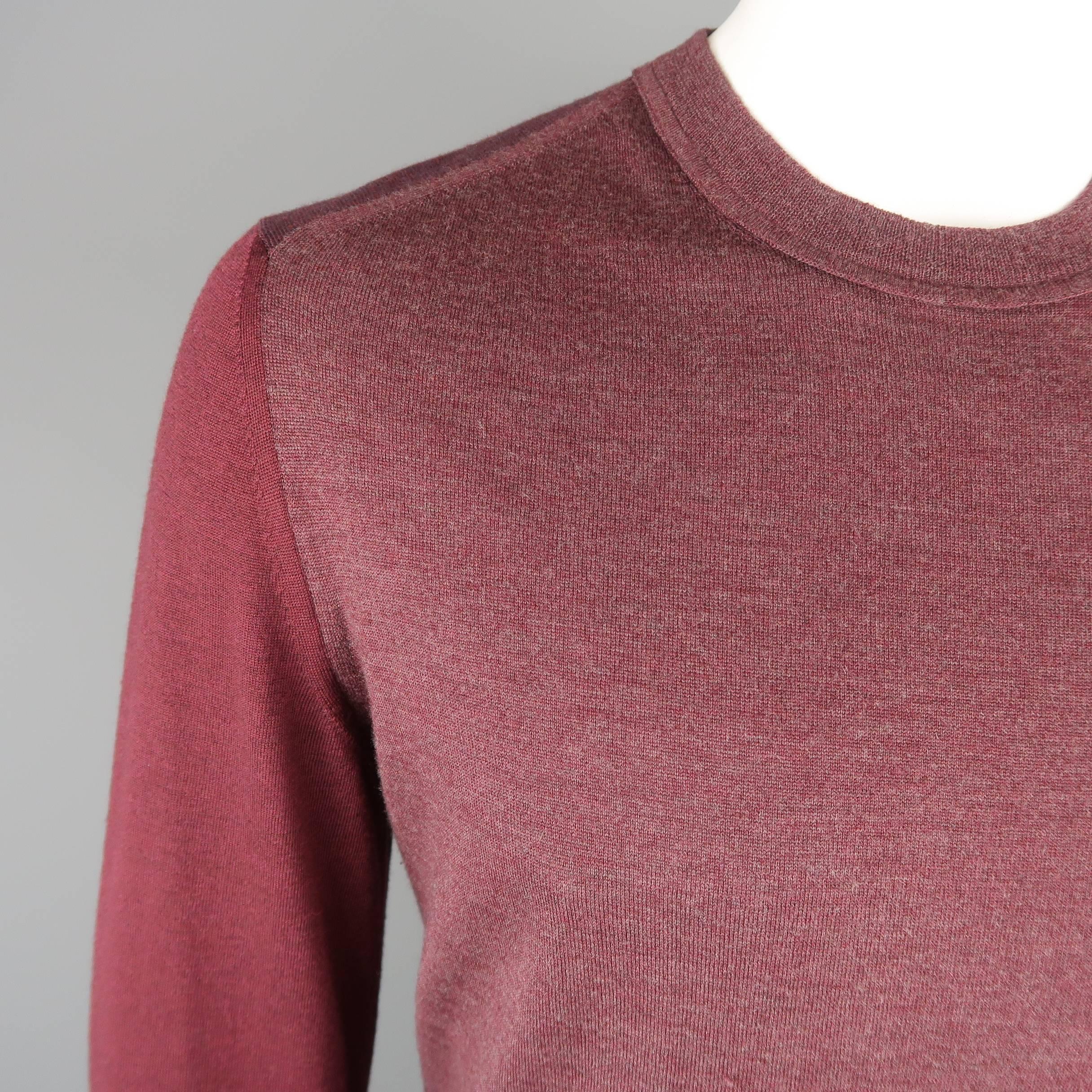 MAISON MARTIN MARGIELA sweater comes in a light weight wool knit with various color block shades of burgundy and stitches at back. Made in Romania.
 
Good Pre-Owned Condition.
Marked: XL
 
Measurements:
 
Shoulder: 17 in.
Chest: 42 in.
Sleeve: 30