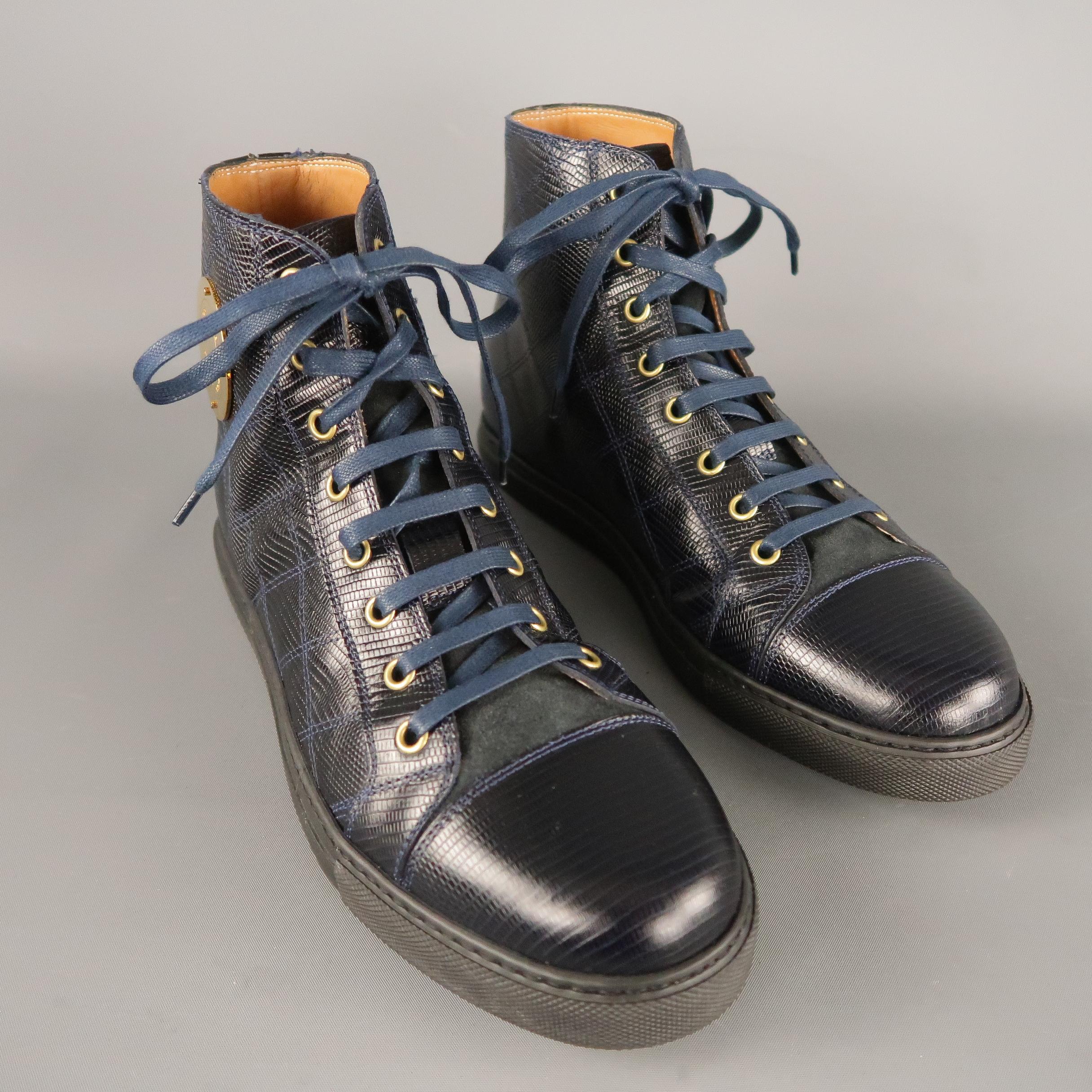 MARC JACOBS High Top Sneakers comes in a navy tone in a lizard quilted leather material, styled with a cap toe and a gold tone metal brand hardware. With Box. Made in Italy.
 
Excellent Pre-Owned Condition.
Marked: 40 IT
 
Measurements:
 
Length: 11