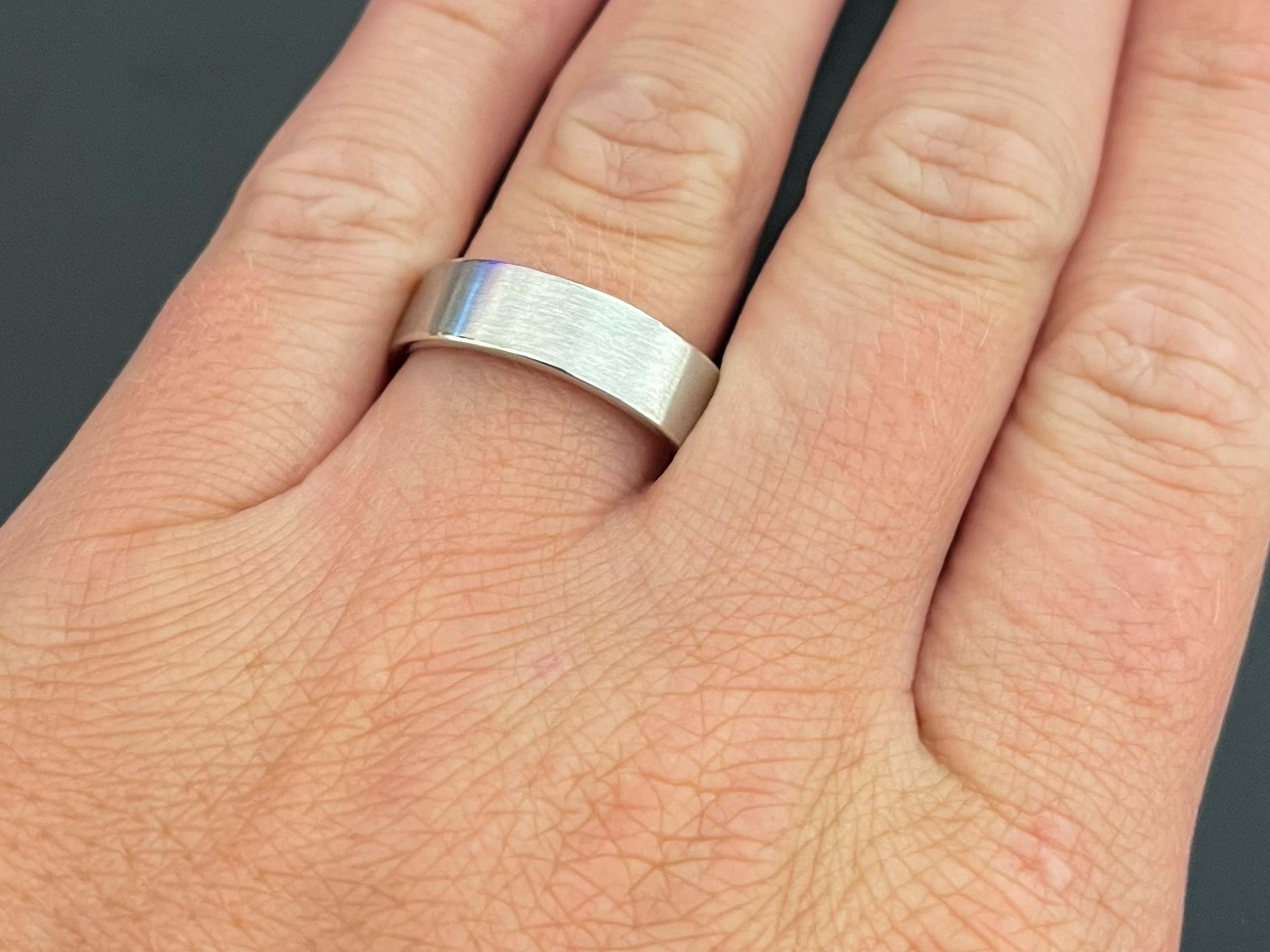 Mens Matte Wedding Band Ring in Platinum. This band is beautifully crafted in platinum 950 with a matte satin finish. The band is 6 mm wide, size 9.25 and total weight is 10.9 grams. The band is stamped 