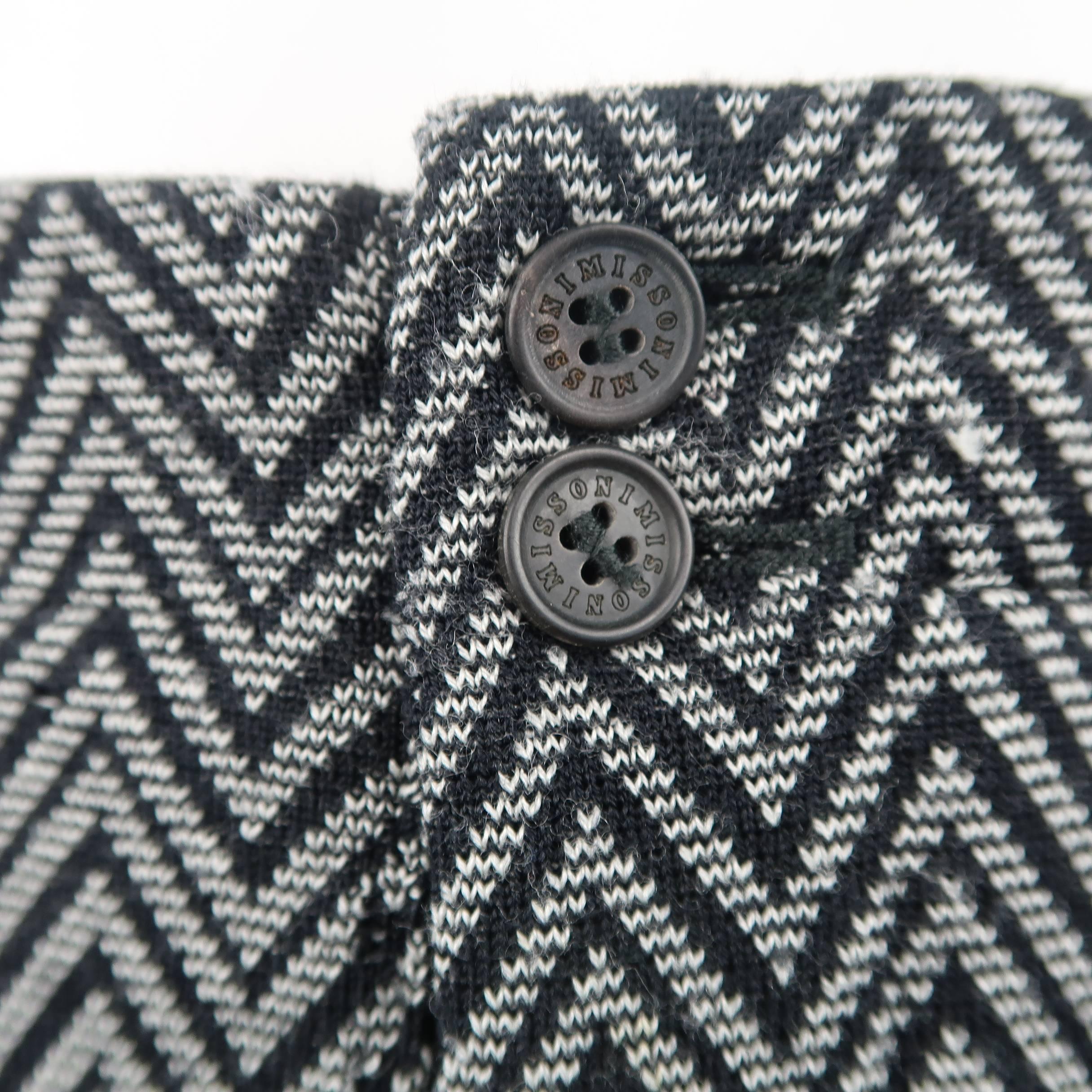 Vintage MISSONI pants come in a gray and black zigzag chevron print  wool blend knit with a straight leg and patch pocket back. Discolorations, wear, and holes throughout. As-is. Made in Italy.
 
Fair Pre-Owned Condition.
Marked: IT 46
