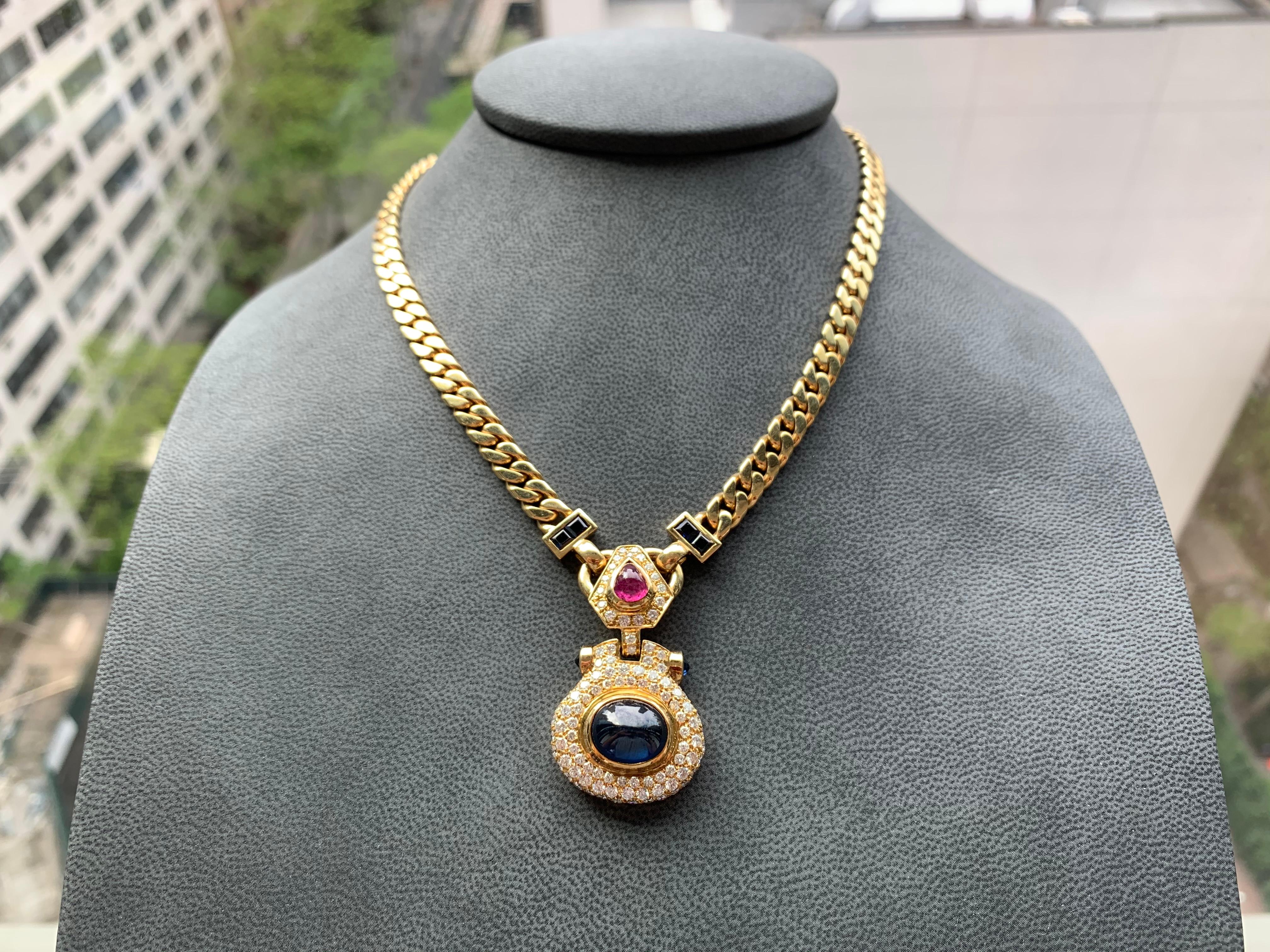 Set with a cabochon sapphire

Accented with approx 3.22 cts of diamonds and a approx 1.72 ct ruby

18 karat yellow gold

Approx 19 inches long

92 Grams gross weight