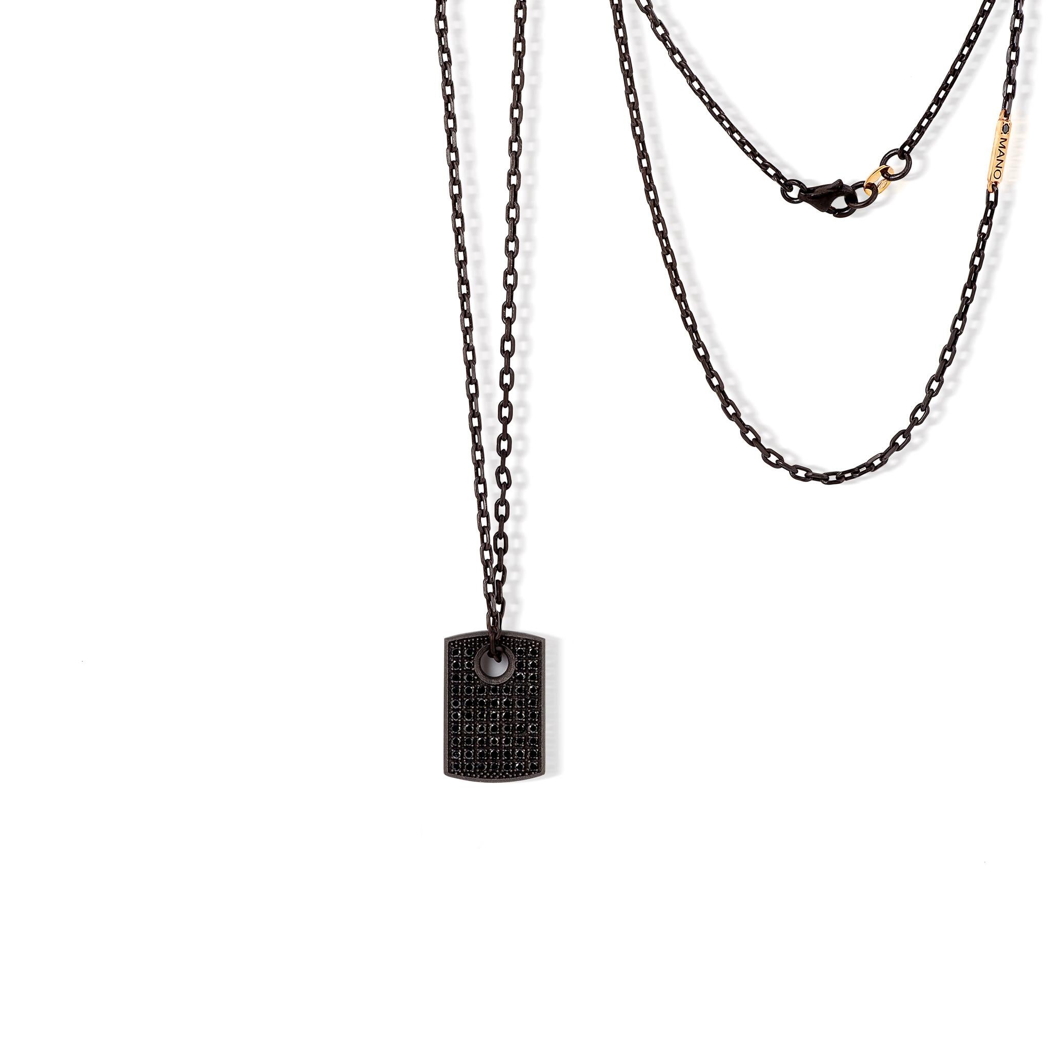 Men's necklace in titanium, black diamonds, 18 kt red gold, 9 kt red gold and chain. The titanium plaque, the star of this necklace, is completely covered with black diamonds. The pavè of 61 black diamonds occupies the entire surface of the plaque.