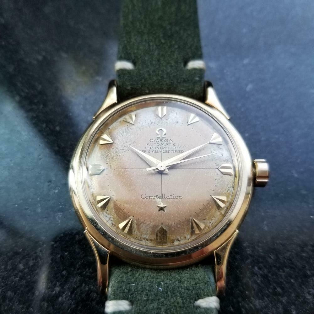 Timeless classic, men's 14k gold Omega Constellation De Luxe automatic, c.1954. Verified authentic by a master watchmaker. Original, unrestored Omega dial, tanned with age, applied gold faceted triangle hour markers, gold minute and hour hands,