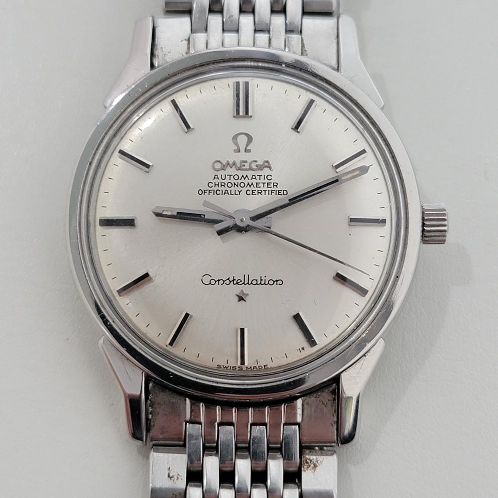 Vintage classic, Men's Omega Constellation automatic, c.1960s in excellent vintage condition. Verified authentic by a master watchmaker. Omega signed silver dial, applied baton hour markers, silver minute and hour hands, sweeping central second
