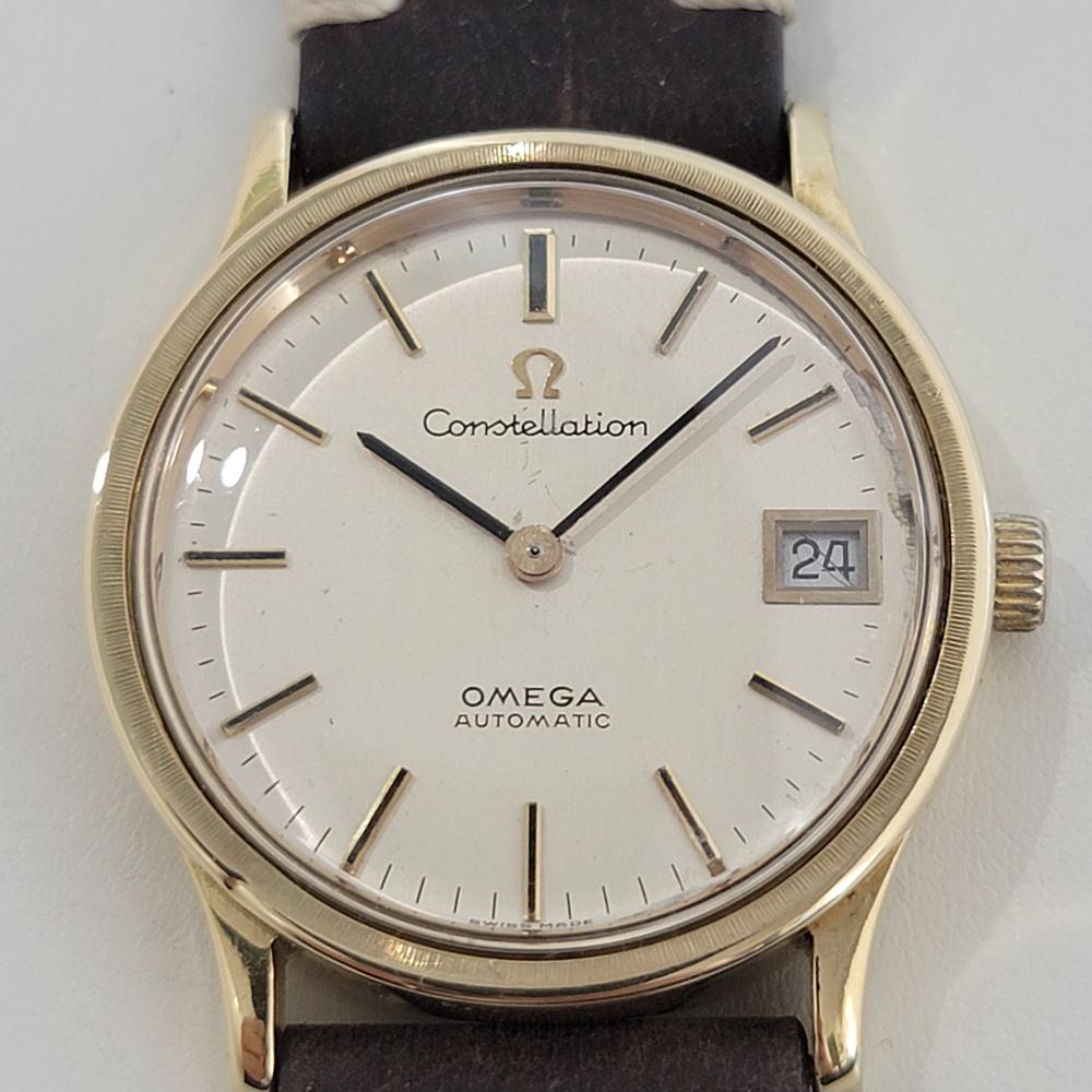 Classic, refined luxury, Men's 18k solid gold Omega Constellation Ref. 166.052 date automatic, c.1969, in excellent vintage, working condition. Verified authentic by a master watchmaker. Omega signed gold dial, applied baton hour markers, gilt