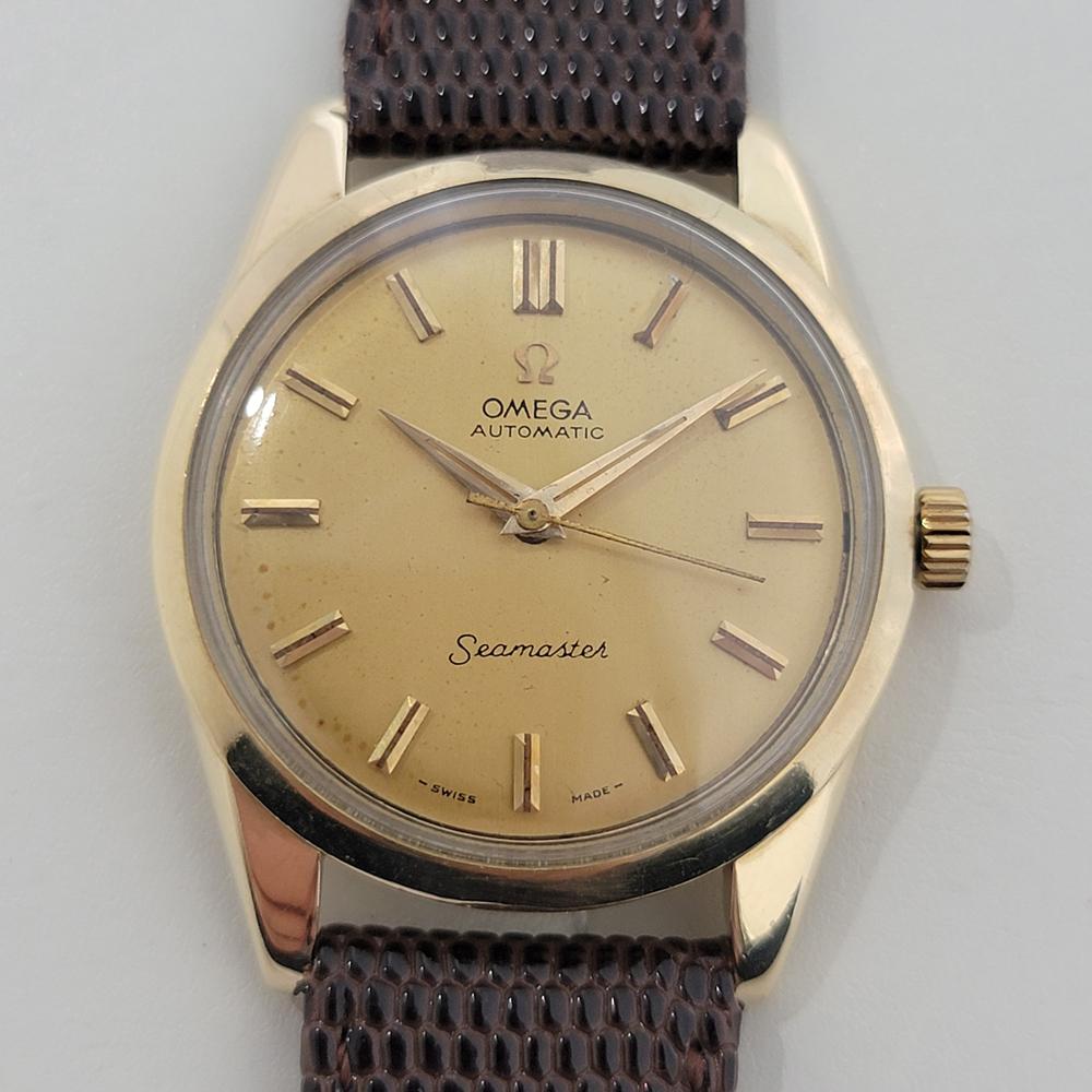 Timeless luxury, Men's 14k solid gold Omega Seamaster Ref. 2975SC automatic, c.1950s in excellent vintage condition. Verified authentic by a master watchmaker. Omega signed gold dial, applied baton hour markers, gilt minute and hour hands, sweeping
