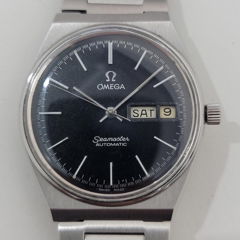 Classic vintage, Men's Omega Seamaster day date automatic, c.1979. Verified authentic by a master watchmaker. Original Omega black dial, applied baton index hour markers, silver minute and hour hands, sweeping central second hand, day and date