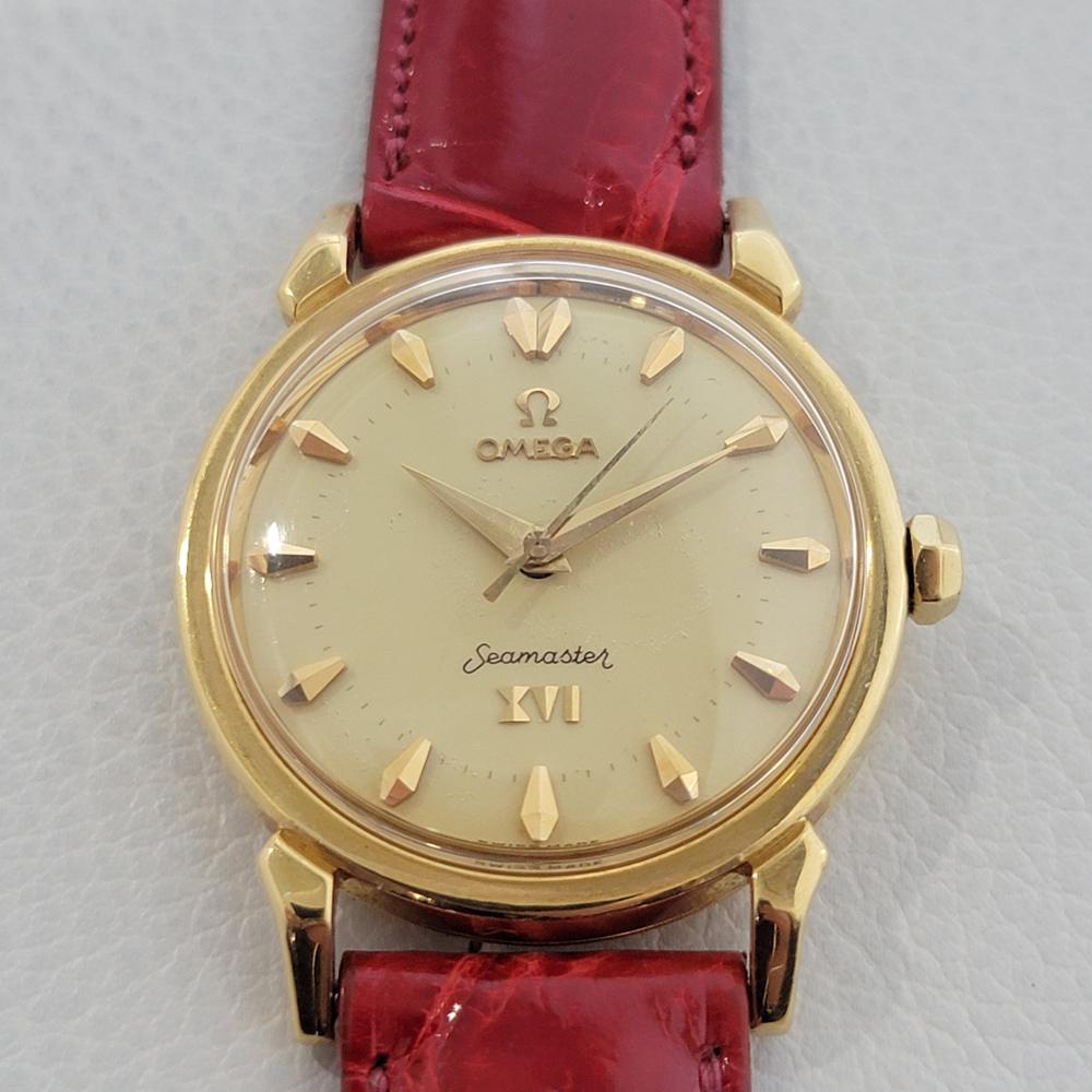 Historical, timeless classic, Men's 18k solid gold Omega Seamaster 1956 XVI Olympic dress watch, c.1950s, rare collectible with original Omega box. Verified authentic by a master watchmaker. Gorgeous Omega signed dial, applied indice hour markers,