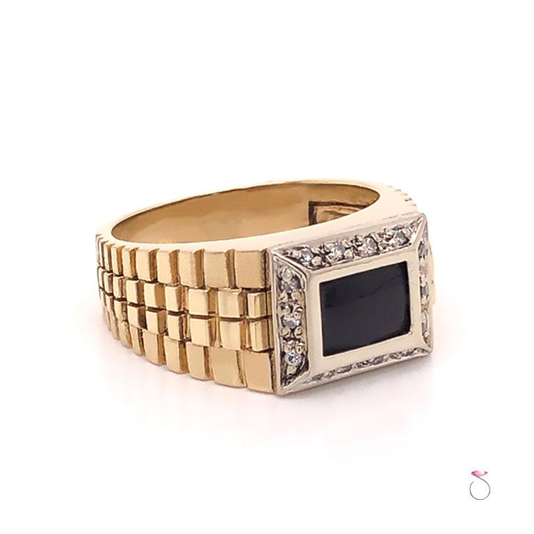Vintage men's Onyx & Diamond ring in 14K yellow gold. This beautiful ring features a rectangular shape black onyx, bezel set at the center. The Onyx measures approximately 7.00 mm x 5.00 mm. The Onyx is surrounded by a diamond halo containing 14