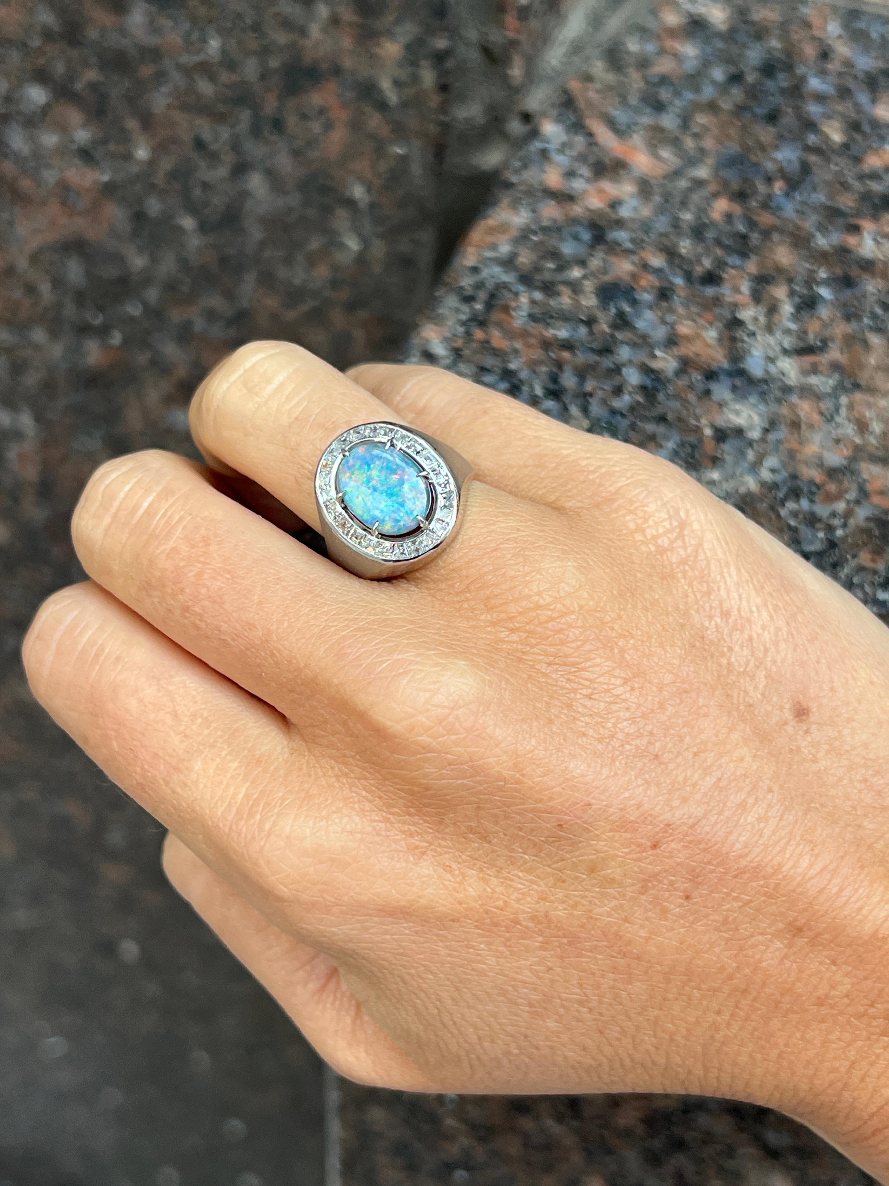Men's Opal & Diamond Ring

A men's ring featuring a oval opal surrounded by baguette cut diamonds.

Opal Weight:  approximately 1.37 carats 
Diamond Weight: approximately .88 carats 
Ring Size: 7.25

Complimentary Resizing 

Opal Weight: 