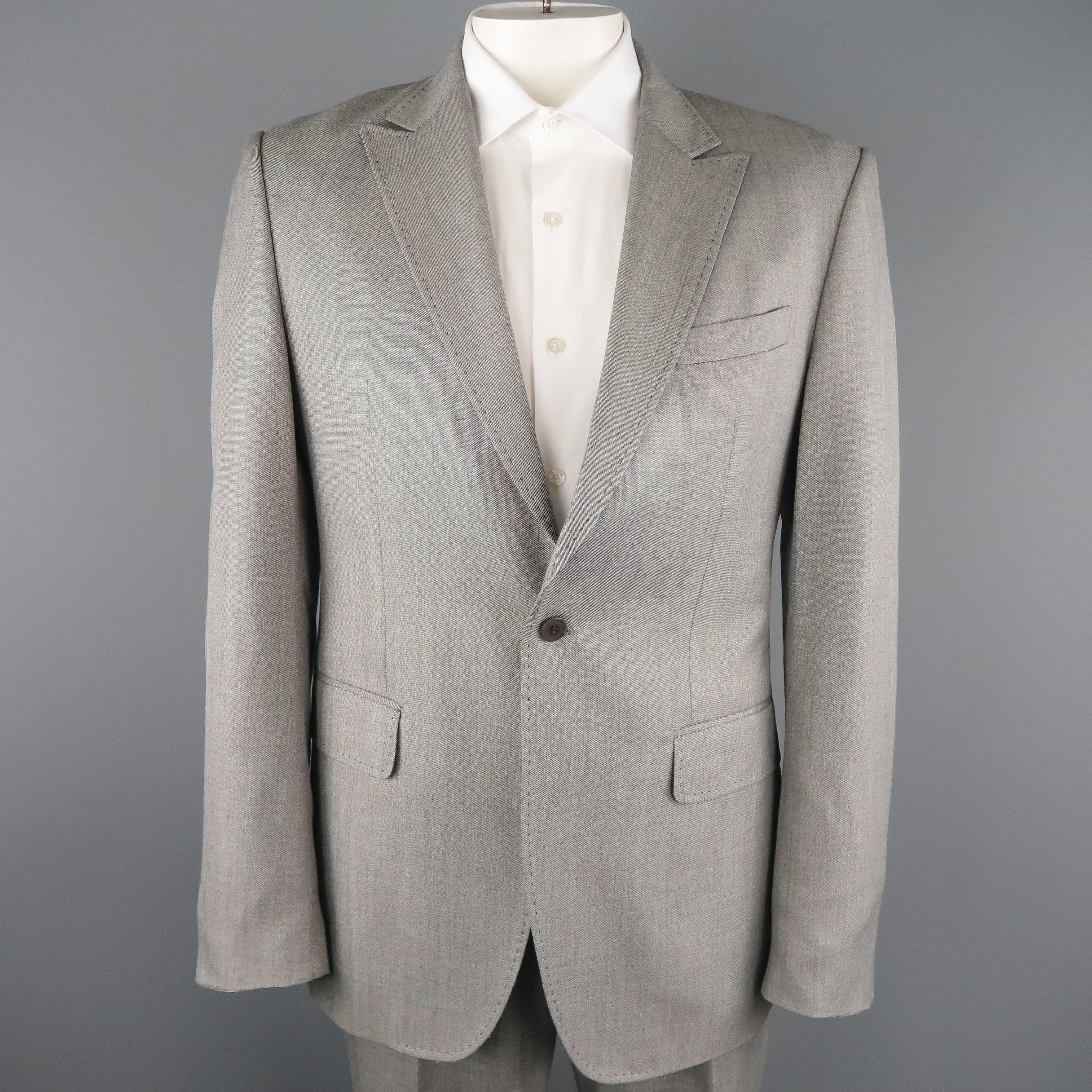 PACO RABANNE suit comes in silver gray wool blend fabric and includes a single breasted, peak lapel, one button sport coat and matching single pleat trousers.
 
Excellent Pre-Owned Condition.
Marked: 105 CM
 
Measurements:
 
-Jacket
Shoulder: 18.5