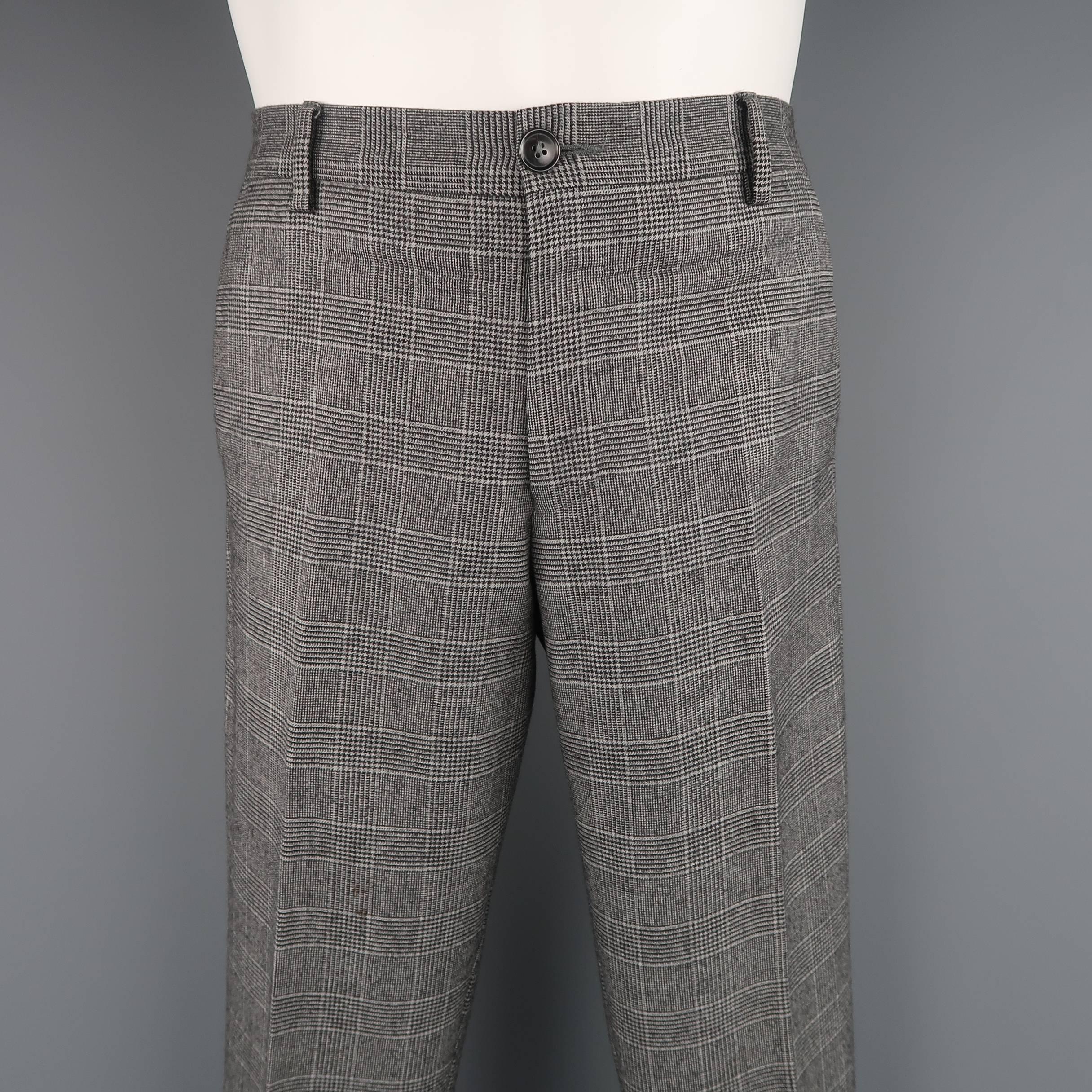 PAUL SMITH dress pants come in light gray glenplaid print wool with a flat front and classic tapered fit. Made in Italy.
 
Good Pre-Owned Condition.
Marked: 32
 
Measurements:
 
Waist: 32 in. (+1 in. )
Rise: 10 in.
Inseam: 32 in. (+2 in. )
 
(Let