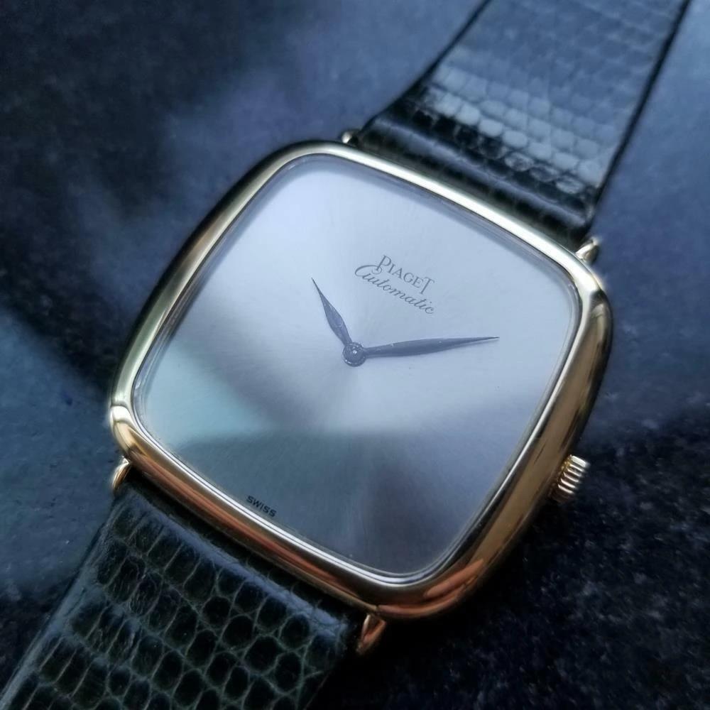 Luxurious classic, men's 18k solid gold Piaget ultra-thin automatic dress watch, c.1980s. Verified authentic by a master watchmaker. Gorgeous non-hour markers Piaget signed dial, black minute and hour hands, hands and dial in excellent vintage .