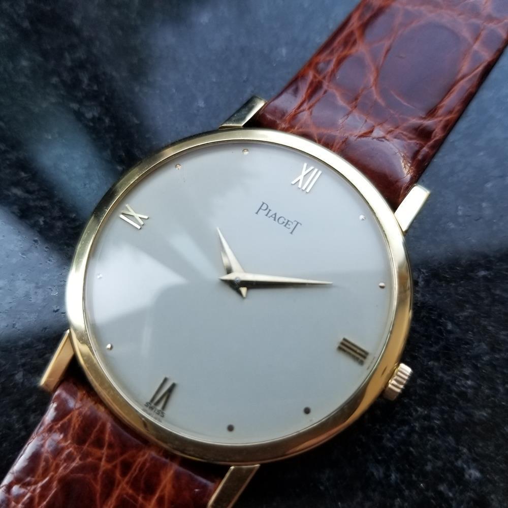 Classic luxury, men's 18K solid gold Piaget cal.9P manual wind dress watch, c.1970s. Verified authentic by a master watchmaker. Gorgeous silvery white Piaget signed dial, applied gold droplet and Roman numeral 3, 6, 9 and 12 hour markers, gold