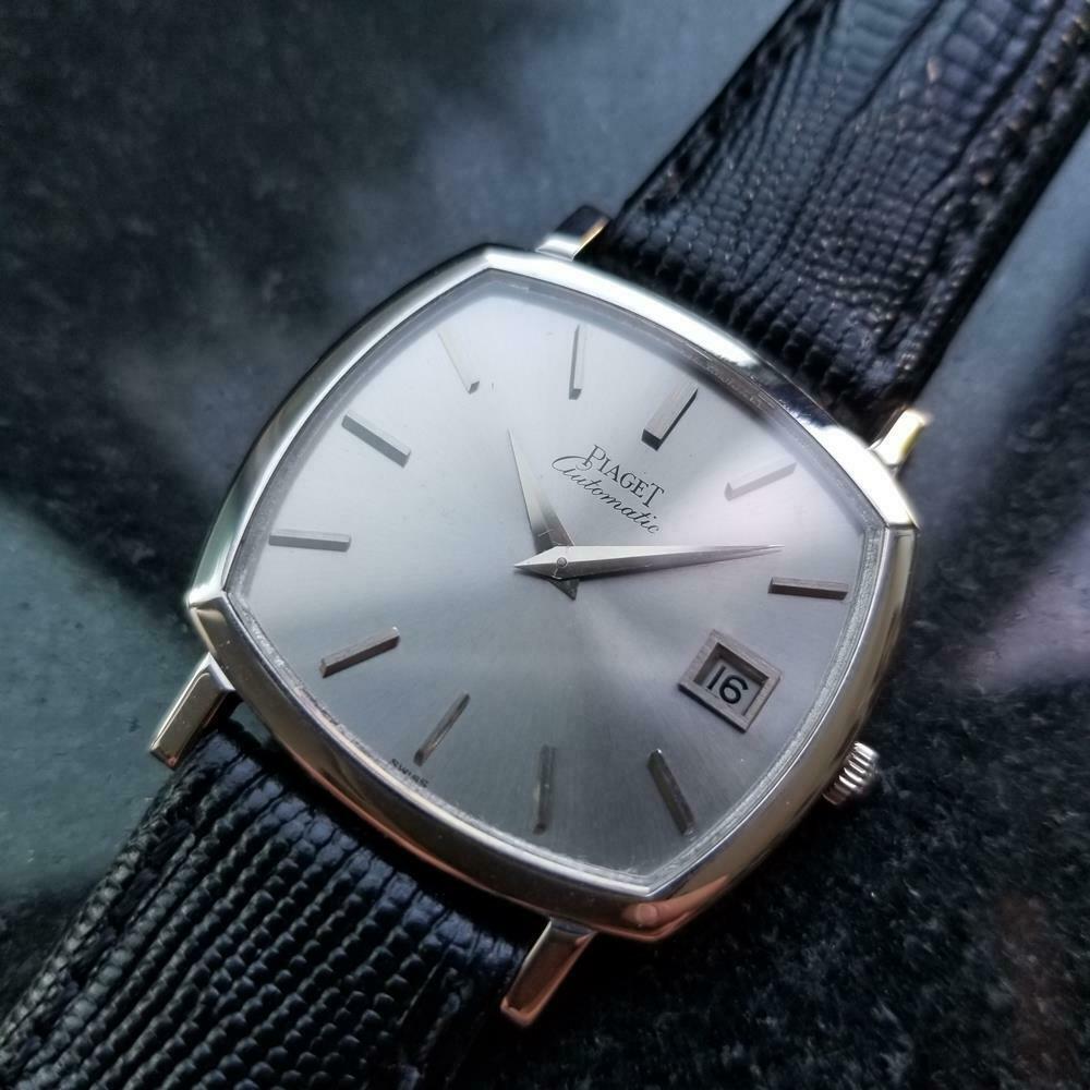 Timeless luxury, men's 18k solid white gold Piaget automatic with date, c.1970s. Verified authentic by a master watchmaker. Gorgeous vintage silver Piaget signed dial, applied silver indice hour markers, silver minute and hour hands, date display at