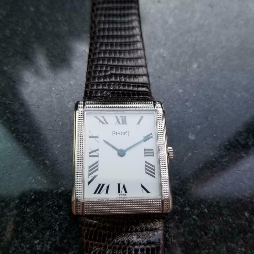 Timeless classic, 18K solid white gold midsize Piaget cal.9P manual wind dress watch, c.1970s. Verified authentic by a master watchmaker. Gorgeous white Piaget signed dial, painted on black Roman numeral hour markers, steel blue minute and hour