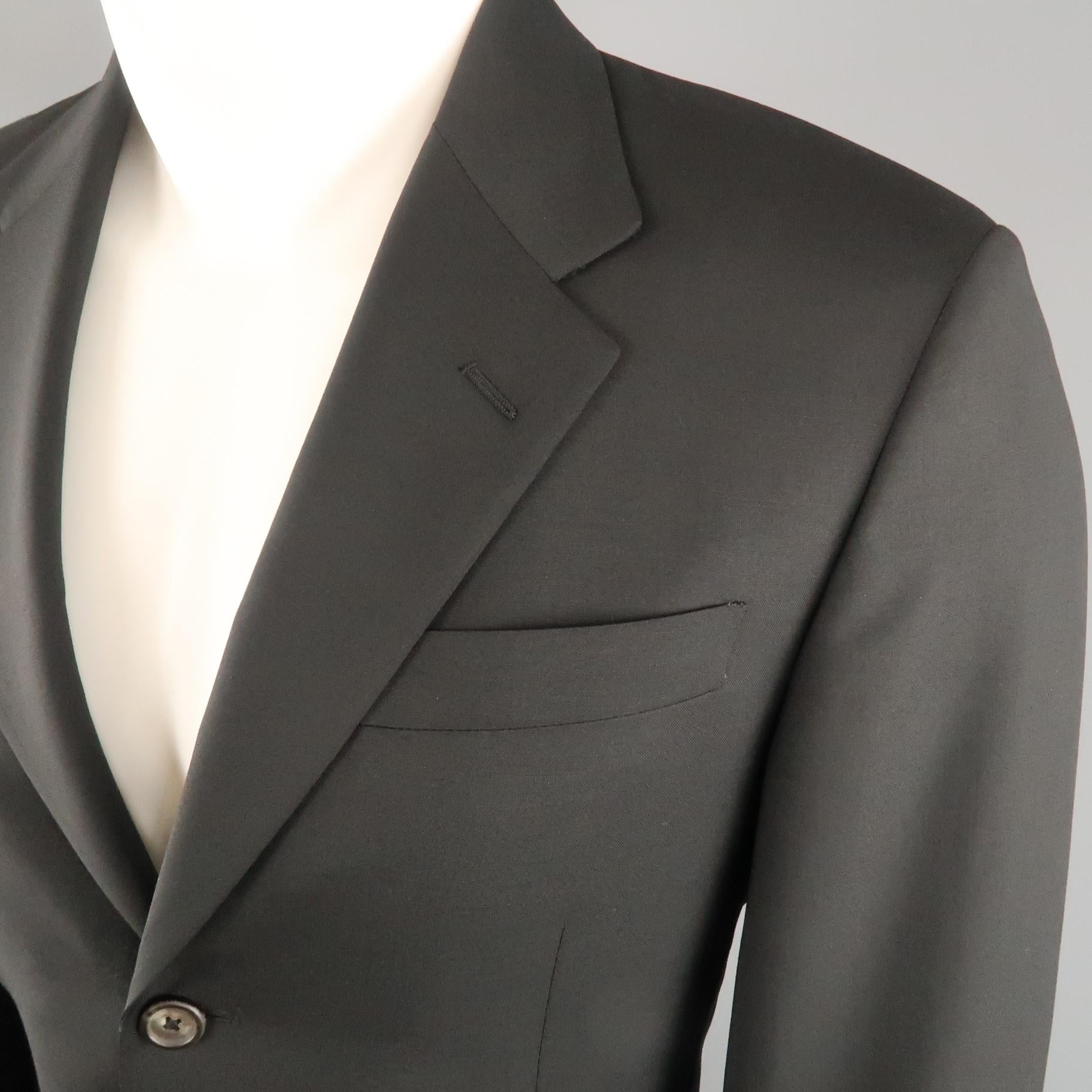 PRADA sport coat comes in black wool with a notch lapel, single breasted,  three button front, and flap pockets. Made in Italy.
 
Excellent Pre-Owned Condition.
Marked: IT 48
 
Measurements:
 
Shoulder: 17.5 in.
Chest: 40 in.
Sleeve: 26 in.
Length: