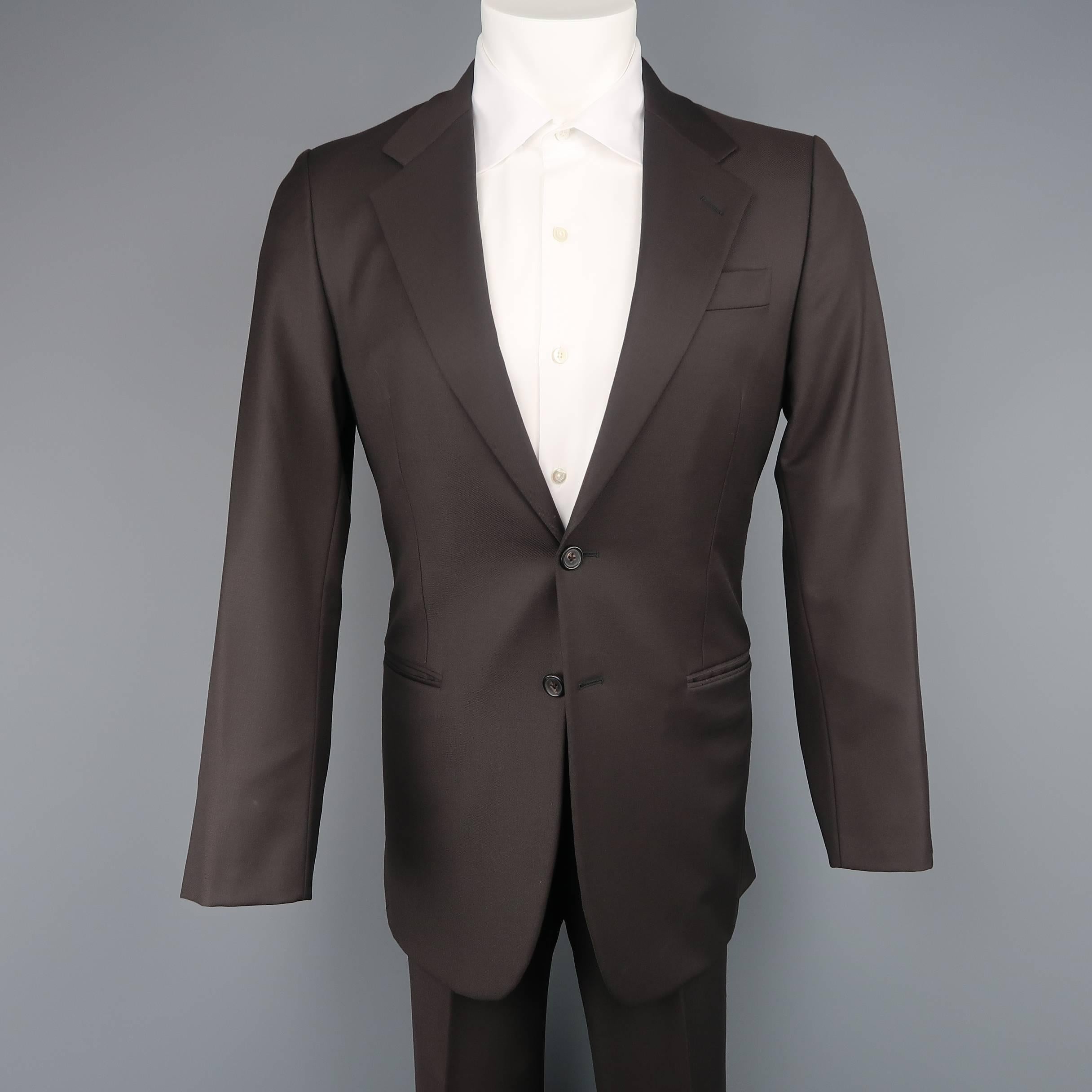 Two piece PRADA suit comes in brown wool twill and includes a single breasted, two button sport coat with notch lapel and matching flat front pants. Made in Italy.
 
Excellent Pre-Owned Condition.
Marked: IT 48 R
 
Measurements:
 
Jacket
Shoulder: