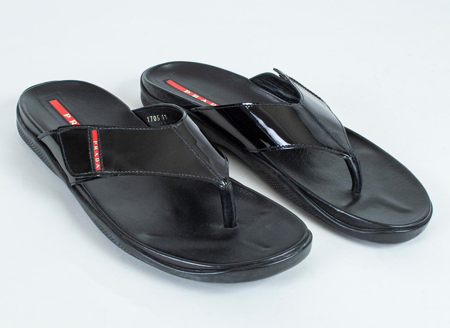 The ultimate in casual luxury, these sandals offer a padded comfort footbed and a non-slip textured rubber sole for safety. Their mirror-shine patent leather strap and iconic red logo impart unexpected style in a small package.

Black patent leather