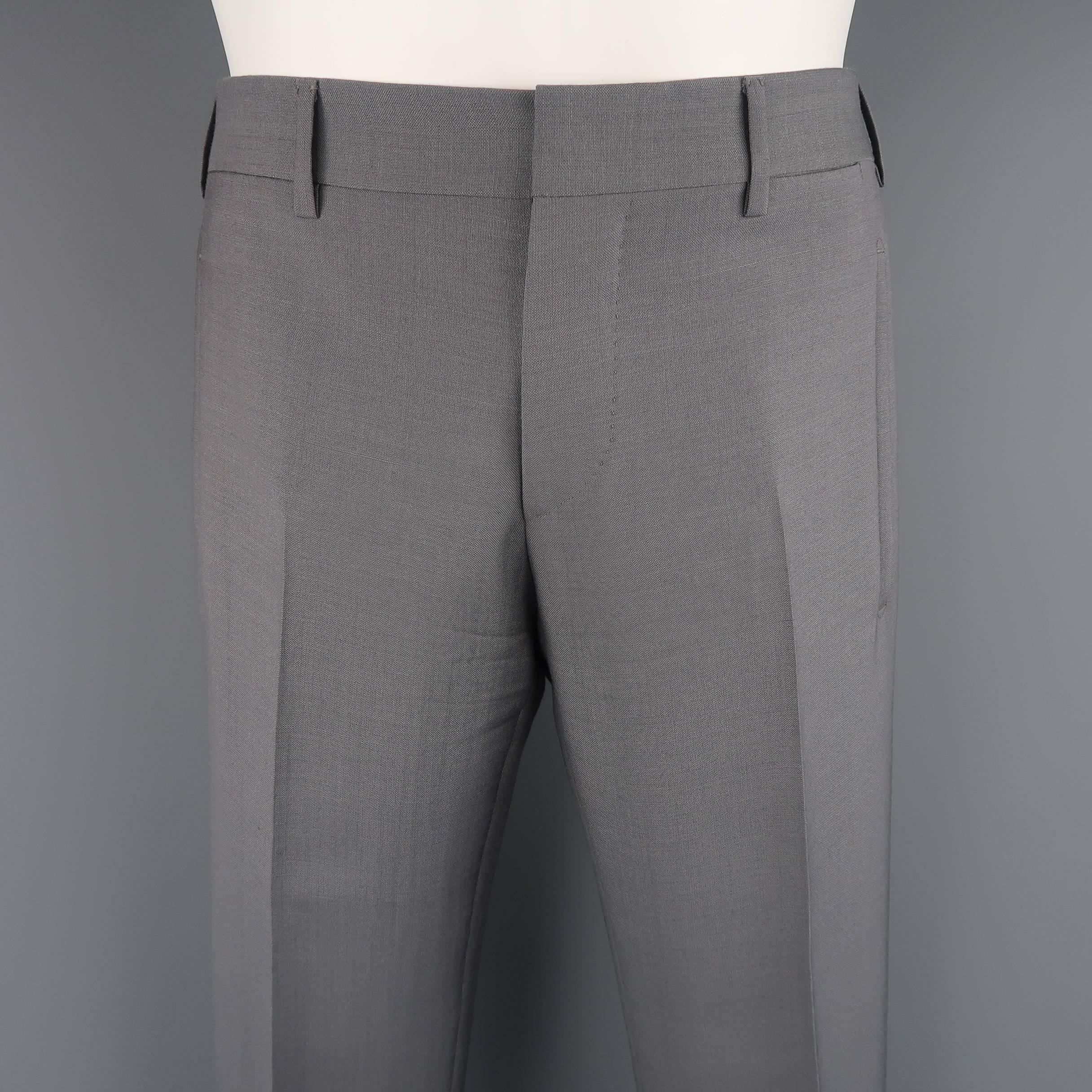 Flat front PRADA pants come in gray mohair wool blend with a slit pockets. Made in Italy
 
Excellent Pre-Owned Condition.
Marked: 46 R
 
Measurements:
 
Waist: 31 in. (+3 in.)
Rise: 8.5 in.
Inseam: 30 in. (+3 in.)
 
(Let Out Room)
