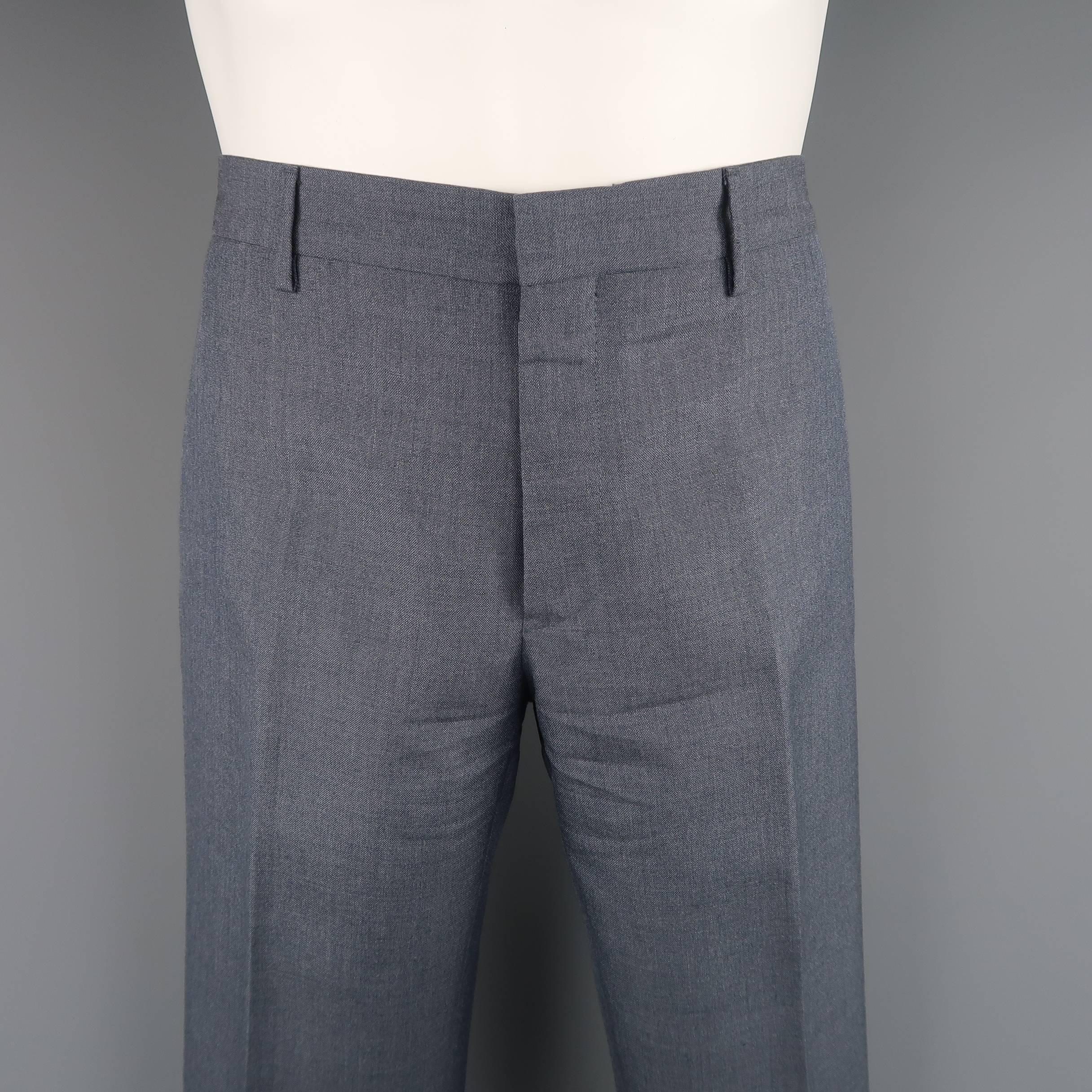 Flat front PRADA dress pants come in steel blue gray mohair wool blend with slit pockets. Made in Italy.
 
Excellent Pre-Owned Condition.
Marked: IT 48
 
Measurements:
 
Waist: 32 in. (+2 in. )
Rise: 9.5 in
Inseam: 30 in. (+2 in. )
 
(Let Out Room)
