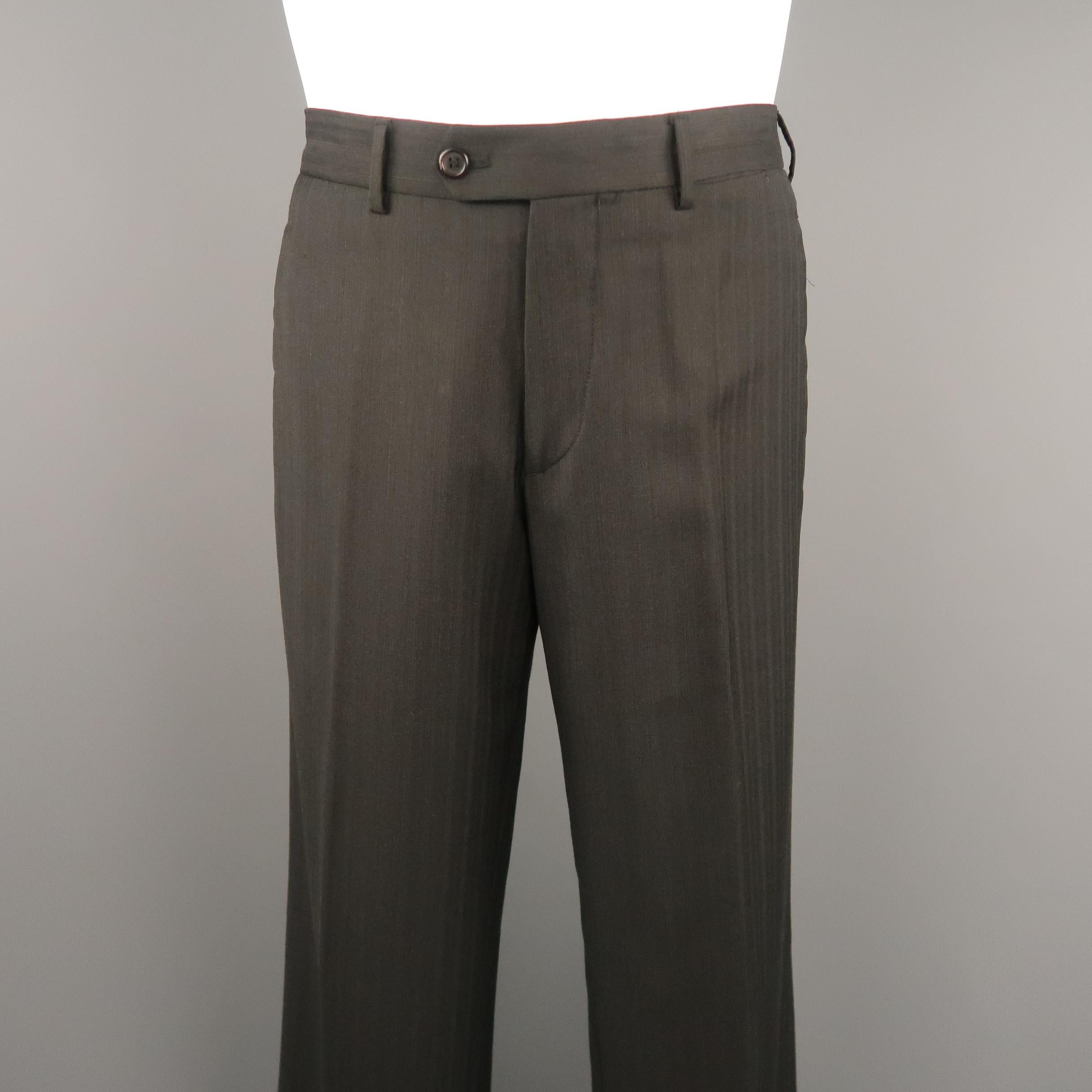 PRADA dress pants come in black & brown striped wool with a relaxed fit and tab button waistband. Made in Italy.
 
Excellent Pre-Owned Condition.
Marked: IT 48
 
Measurements:
 
Waist: 32 in.
Rise: 10 in.
Inseam: 31 in.