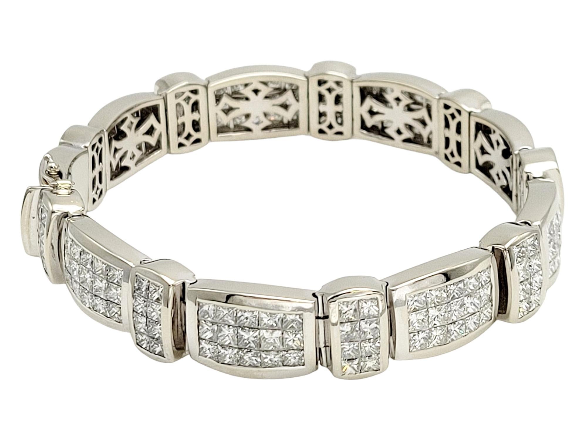 This exquisite 30.93-carat invisible set princess cut diamond link bracelet is a marvel of fine jewelry craftsmanship. This magnificent piece boasts 207 dazzling princess-cut diamonds, seamlessly and invisibly set throughout the entire bracelet,