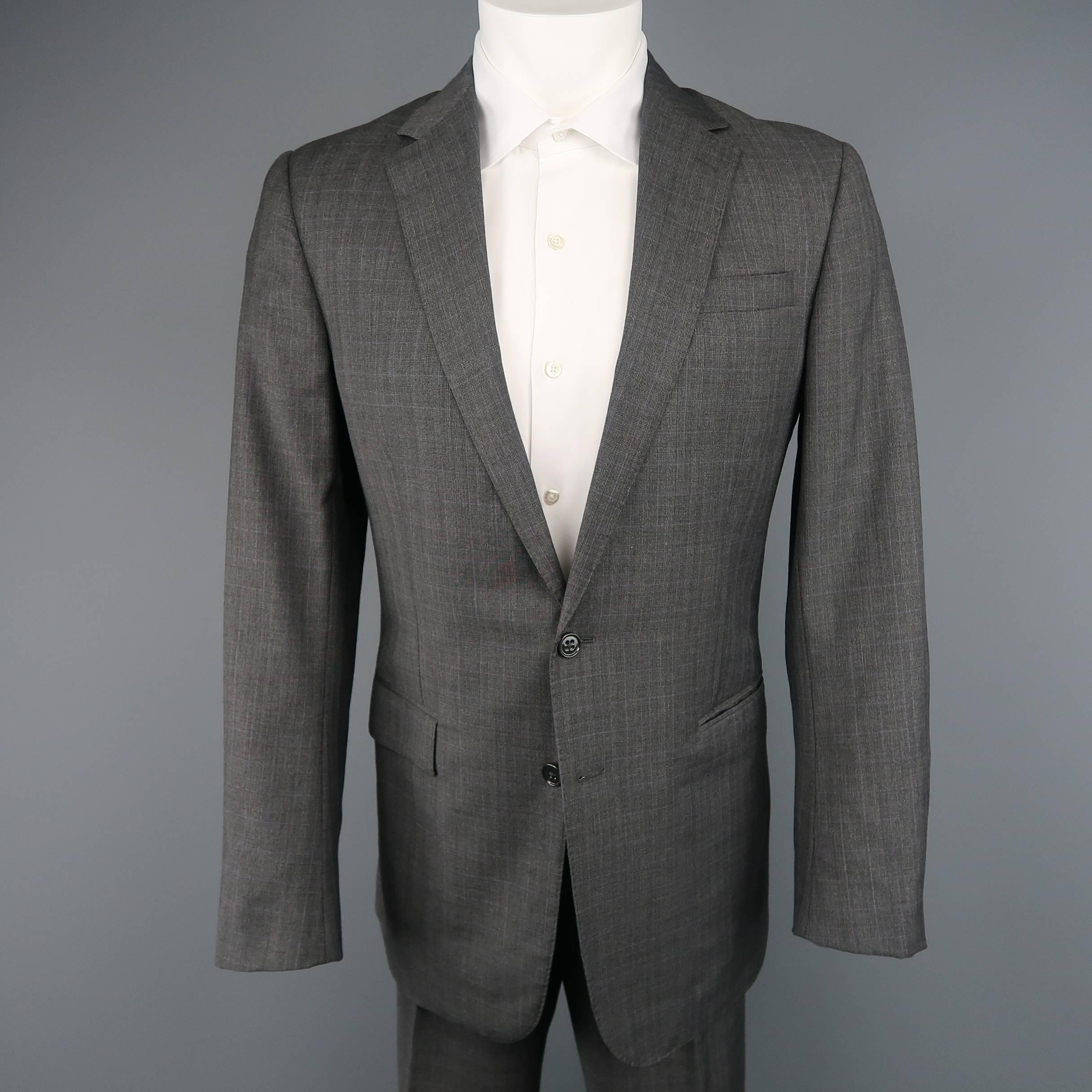 Two piece suit by RALPH LAUREN BLACK LABEL comes in dark gray and lavender glenplaid  wool and includes a single breasted two button sport coat with notch lapel and matching flat front trousers with side tabs.  Made in Italy.
 
Excellent Pre-Owned