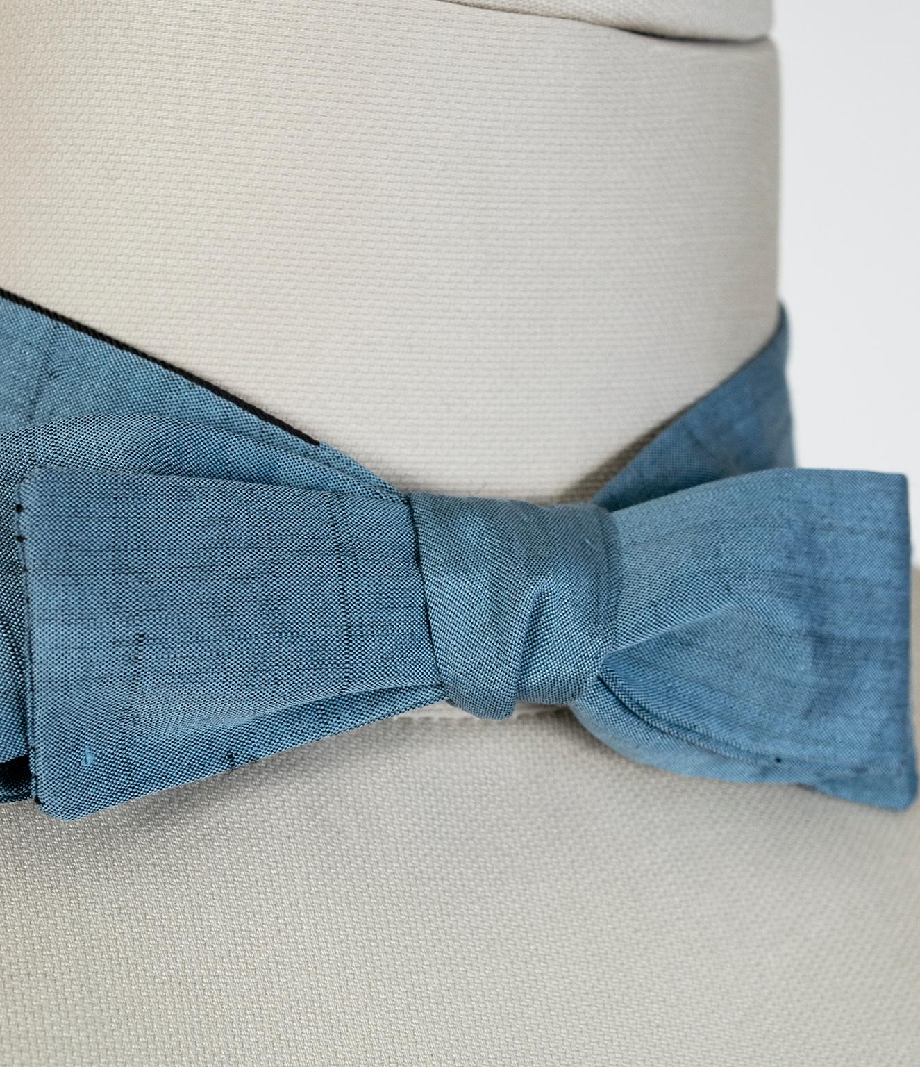 A gentleman in a bow tie is rare enough, but a man who can tie one from scratch is a unicorn. If you are that man, why not go one step further and opt for a vintage model? This one in iridescent cornflower blue silk features a slim profile and