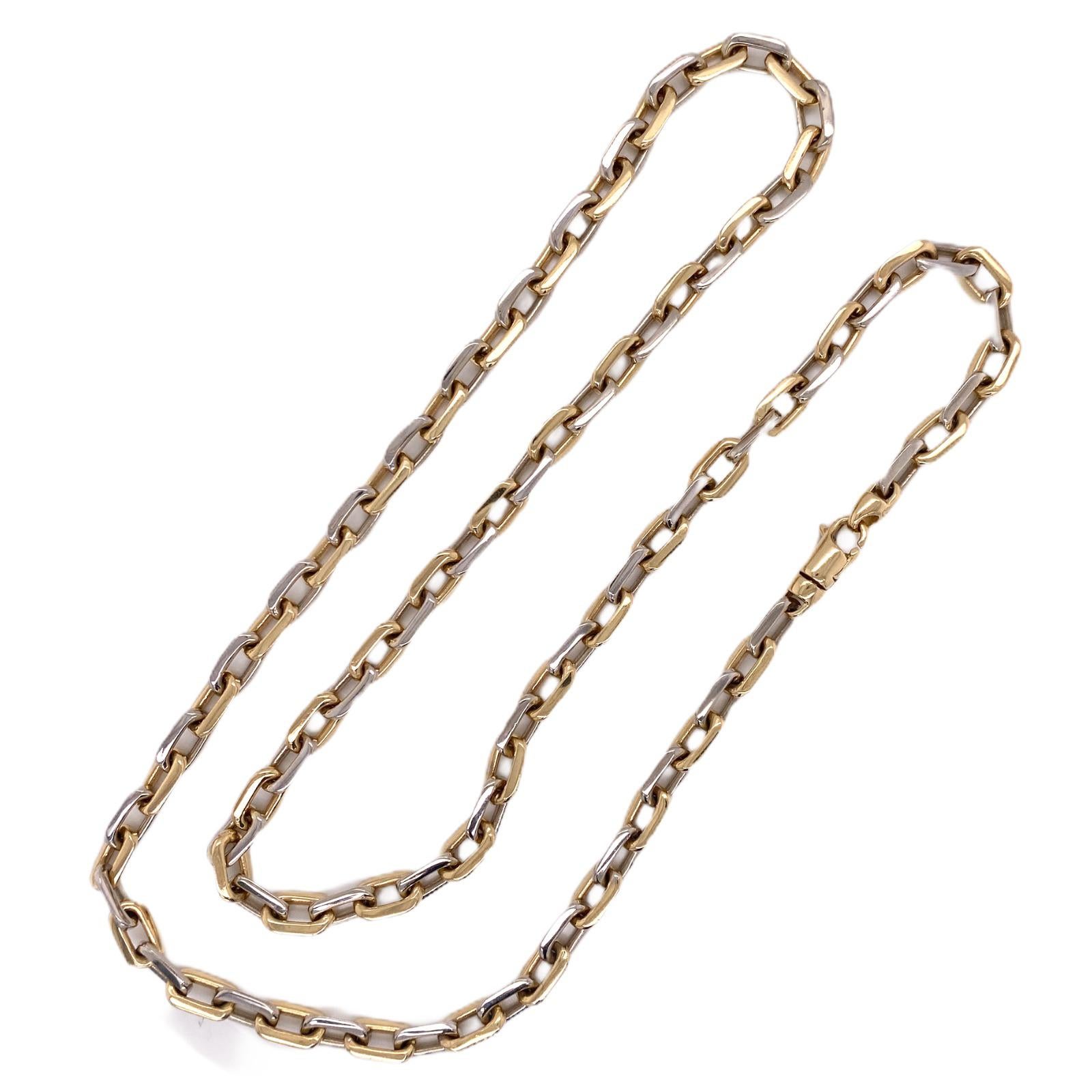 Men's rectangular solid link chain fashioned in 14 karat white and yellow gold. The necklace measures 24 inches in length and 5 mm in width. 