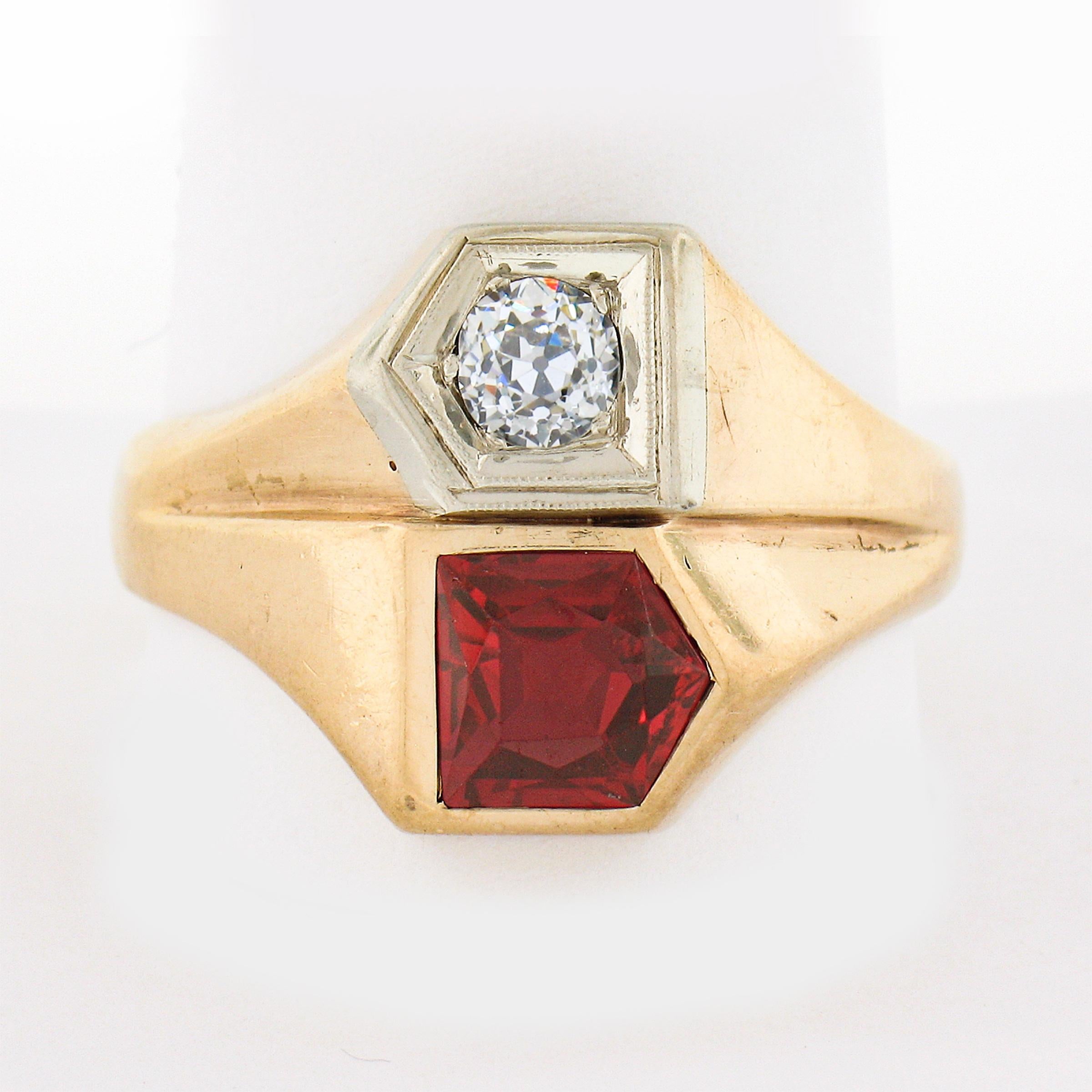 This men's retro vintage ring is crafted in solid 14k yellow gold and features a very fine quality diamond and synthetic ruby neatly set at its top. The stunning diamond is old European cut and is neatly ave set in solid white gold. It weighs