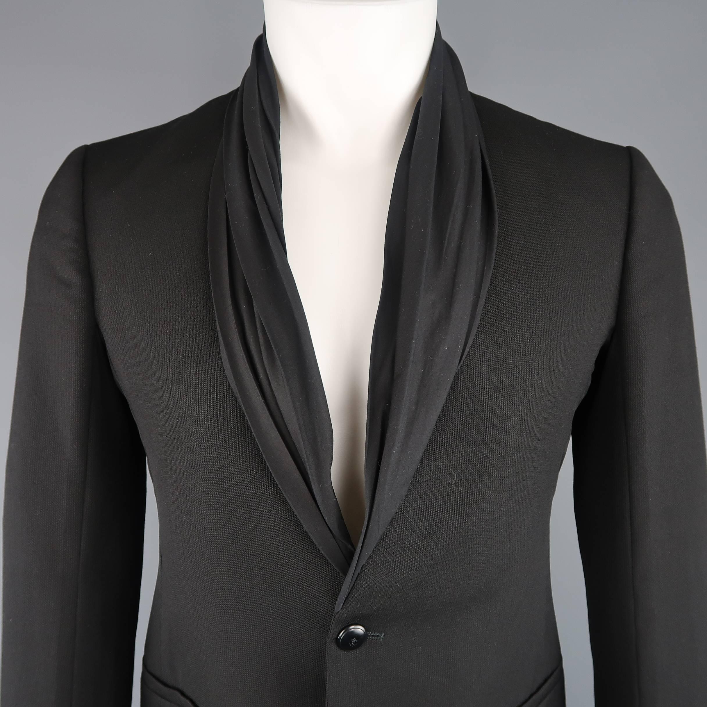 RICK OWENS sport coat comes in black stripe textured wool with a single button, long sleeves with functional button cuffs, double vented back, and draped shawl collar. Made in Italy.
 
New with Tags. Retails $2419.00
Marked: IT 48
 
Measurements:
