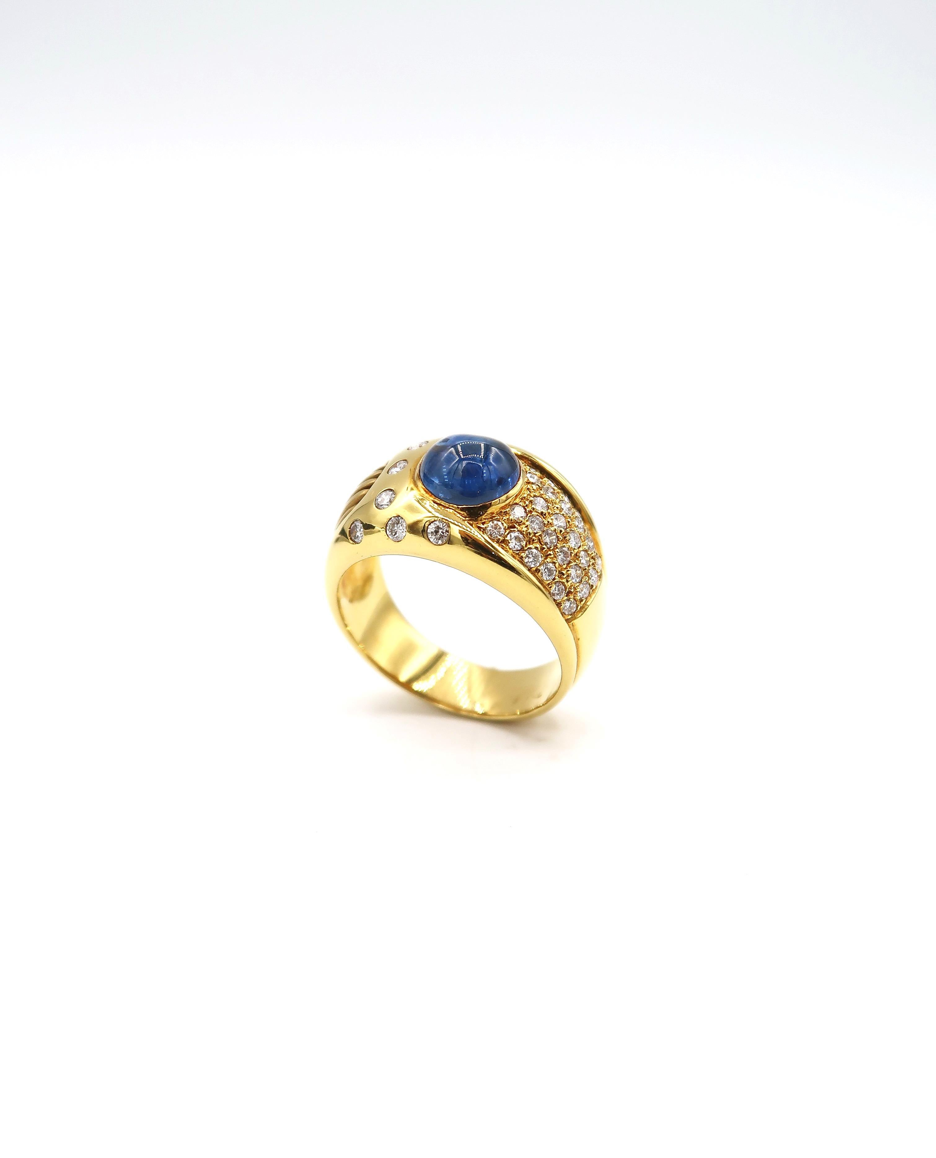 2.55 Carat Cabochon Sapphire Wide Band in 18 Karat Yellow Gold with Diamonds

Ring size: US 9, UK R

Gold: 18K 10.454g.
Sapphire: 2.55cts.
Diamond: 0.79ct.