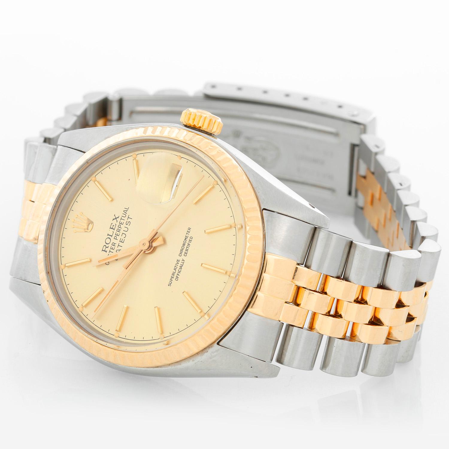 Men's Rolex Datejust 2-Tone Watch 16013 - Automatic winding, 27 jewels, Quickset, acrylic crystal. Stainless steel case with fluted bezel ( 36 mm ). Champagne dial with stick hour markers . Stainless steel and 18k yellow gold Jubilee bracelet.