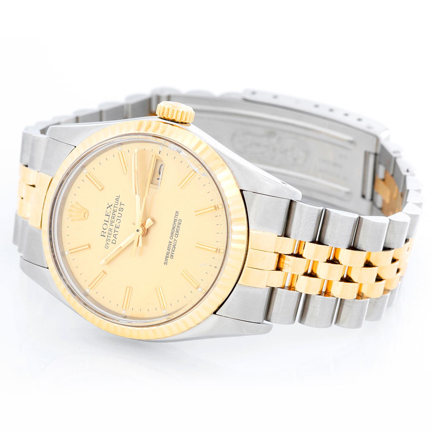 Men's Rolex Datejust 2-Tone Watch 16103 - Automatic winding, 27 jewels, Quickset, acrylic crystal. Stainless steel case with fluted  bezel ( 36 mm ). Champagne dial with stick hour markers. Stainless steel and 18k yellow gold Jubilee bracelet.