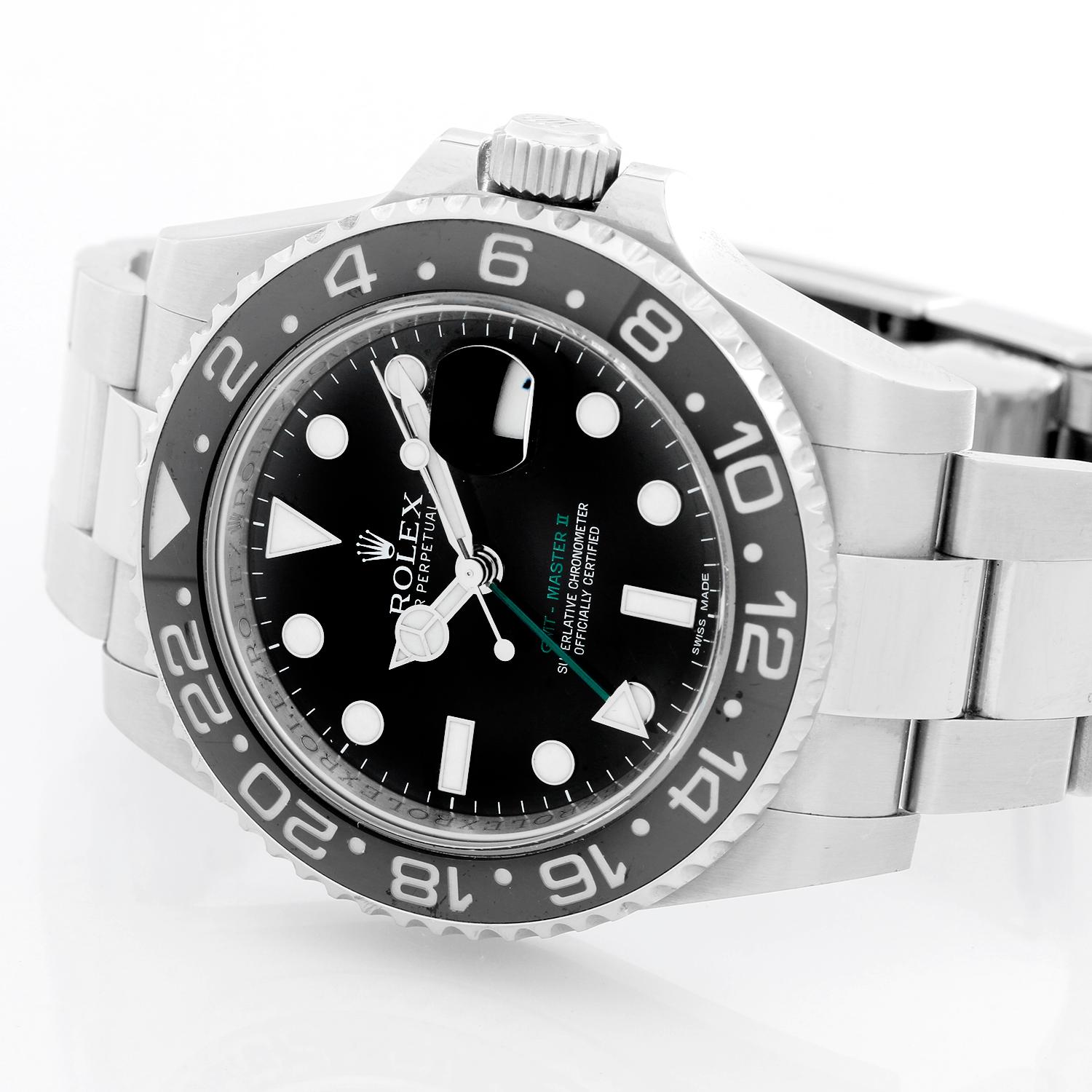 Men's Rolex GMT-Master II Watch 116710 ( 116710N ) - Automatic winding, 31 jewels. Stainless steel case with 24 hour ceramic bezel  ( 40 mm ). Black dial with luminous markers; green GMT hand. Stainless steel Oyster bracelet with flip-lock clasp.