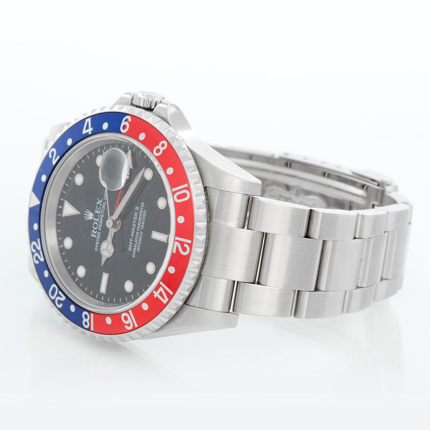 Men's Rolex GMT-Master II Watch 16710 - Automatic winding, 31 jewels, Quickset, sapphire crystal. Stainless steel case; rotating bezel with red/black bezel . Black dial with luminous style markers. Stainless steel Oyster bracelet. Pre-Owned