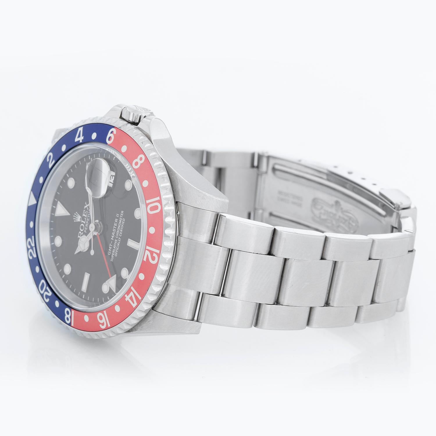 Men's Rolex GMT-Master II Watch 16710 - Automatic winding, 31 jewels, Quickset, sapphire crystal. Stainless steel case; rotating bezel comes with Pepsi bezel and extra black insert ( 40 mm ). Black dial with luminous style markers. Stainless steel