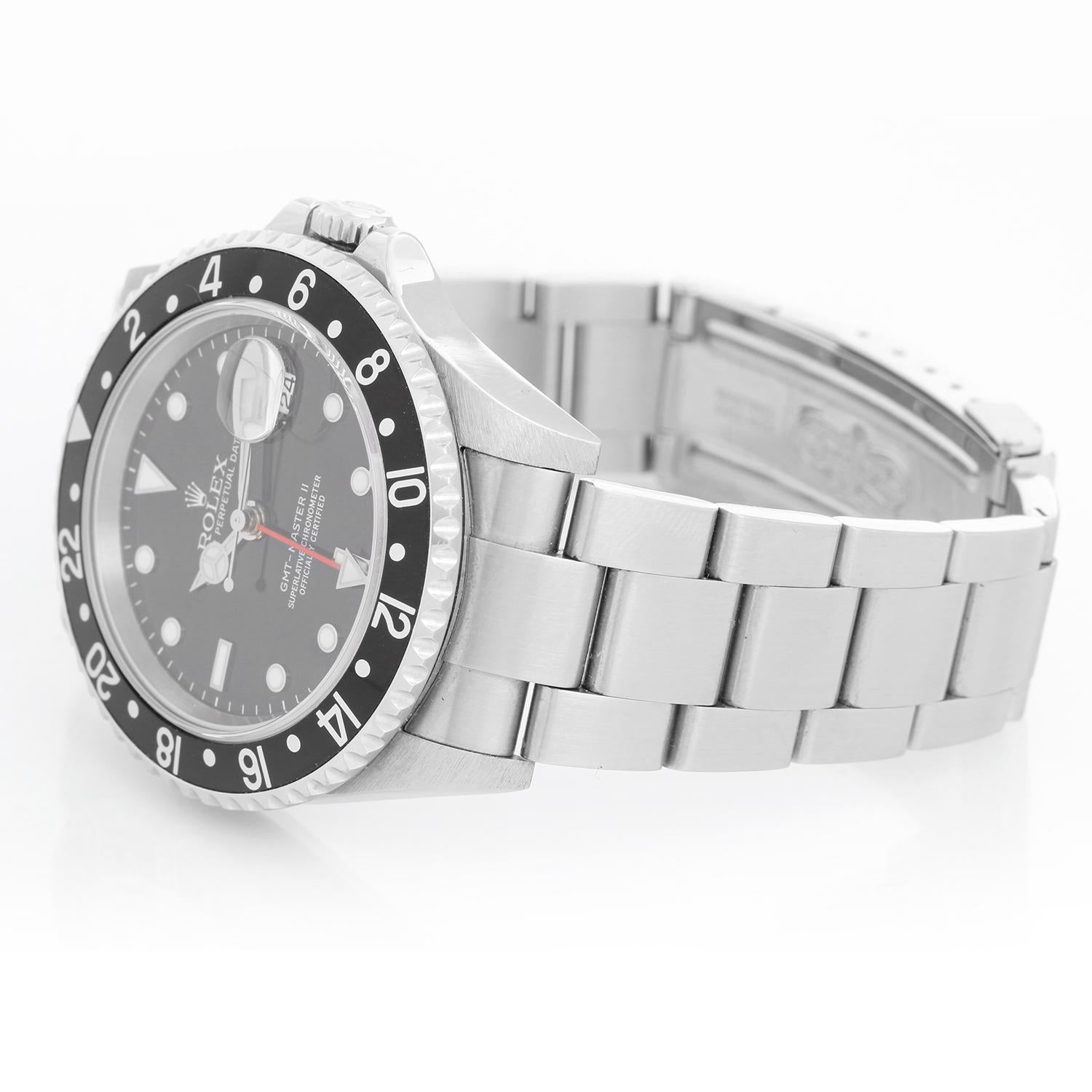 Men's Rolex GMT-Master II Watch 16710LN - Automatic winding, 31 jewels, Quickset, sapphire crystal. Stainless steel case; rotating bezel comes with Pepsi bezel and extra black insert ( 40 mm ). Black dial with luminous style markers. Stainless steel